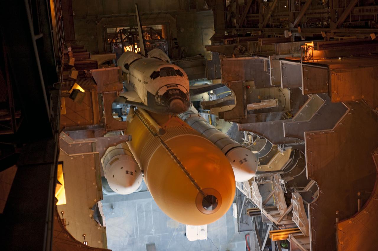 CAPE CANAVERAL, Fla. -- Space shuttle Atlantis, attached to its external fuel tank and solid rocket boosters atop a mobile launcher platform, awaits its final journey from the Vehicle Assembly Building to Launch Pad 39A at NASA's Kennedy Space Center in Florida. "Rollout," as it's called, began at 8:42 p.m. EDT. It will take the crawler-transporter about six hours to carry the shuttle stack to its seaside launch pad. The milestone move paves the way for the launch of the STS-135 mission to the International Space Station, targeted for July 8.      STS-135 will be the 33rd flight of Atlantis, the 37th shuttle mission to the space station, and the 135th and final mission of NASA's Space Shuttle Program. For more information visit, www.nasa.gov/mission_pages/shuttle/shuttlemissions/sts135/index.html. Photo credit: NASA/Kim Shiflett