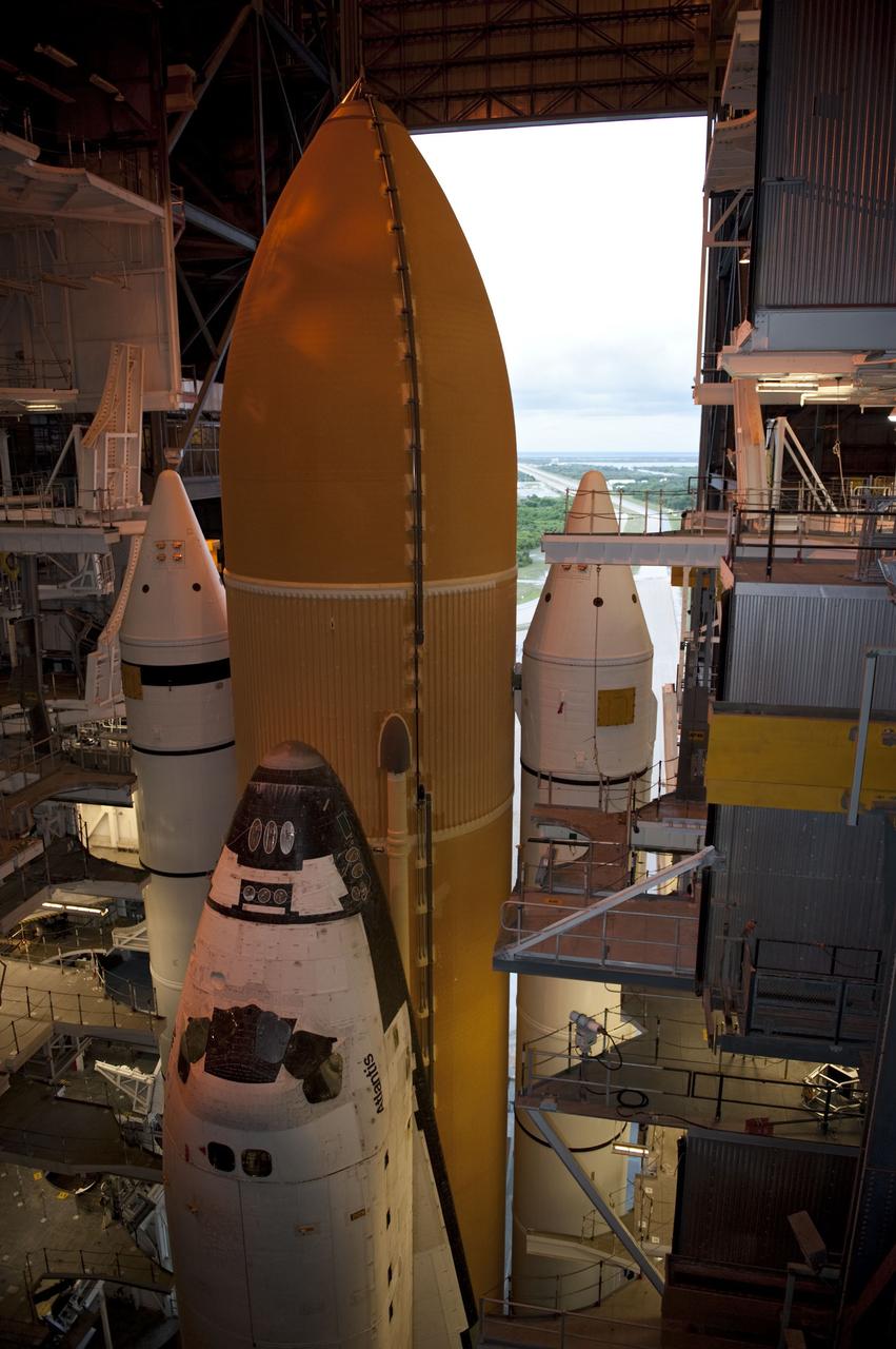 CAPE CANAVERAL, Fla. -- Space shuttle Atlantis, attached to its external fuel tank and solid rocket boosters atop a mobile launcher platform, awaits its final journey from the Vehicle Assembly Building to Launch Pad 39A at NASA's Kennedy Space Center in Florida. "Rollout," as it's called, began at 8:42 p.m. EDT. It will take the crawler-transporter about six hours to carry the shuttle stack to its seaside launch pad. The milestone move paves the way for the launch of the STS-135 mission to the International Space Station, targeted for July 8. STS-135 will be the 33rd flight of Atlantis, the 37th shuttle mission to the space station, and the 135th and final mission of NASA's Space Shuttle Program. For more information visit, www.nasa.gov/mission_pages/shuttle/shuttlemissions/sts135/index.html. Photo credit: NASA/Kim Shiflett