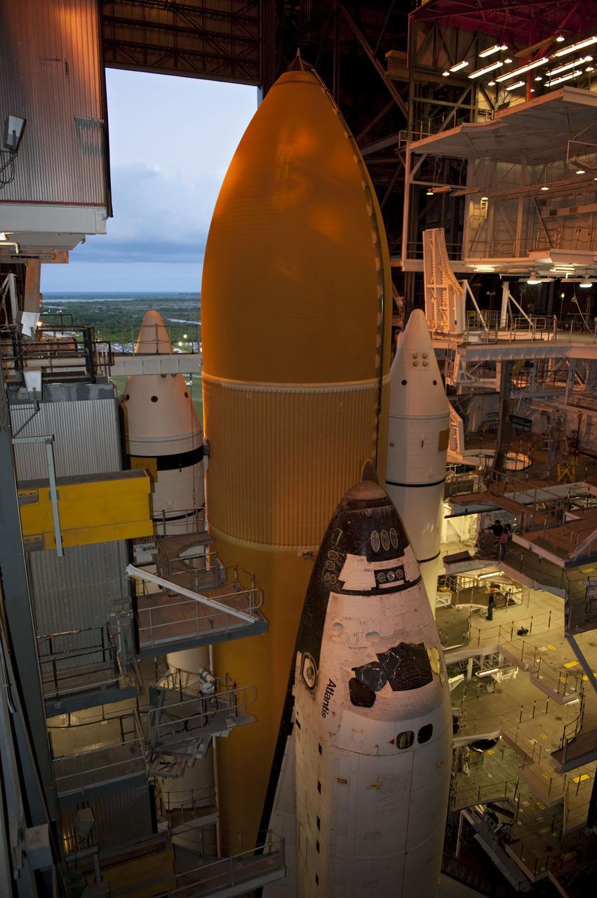 CAPE CANAVERAL, Fla. -- Space shuttle Atlantis, attached to its external fuel tank and solid rocket boosters atop a mobile launcher platform, awaits its final journey from the Vehicle Assembly Building to Launch Pad 39A at NASA's Kennedy Space Center in Florida. "Rollout," as it's called, began at 8:42 p.m. EDT. It will take the crawler-transporter about six hours to carry the shuttle stack to its seaside launch pad. The milestone move paves the way for the launch of the STS-135 mission to the International Space Station, targeted for July 8.          STS-135 will be the 33rd flight of Atlantis, the 37th shuttle mission to the space station, and the 135th and final mission of NASA's Space Shuttle Program. For more information visit, www.nasa.gov/mission_pages/shuttle/shuttlemissions/sts135/index.html. Photo credit: NASA/Kim Shiflett