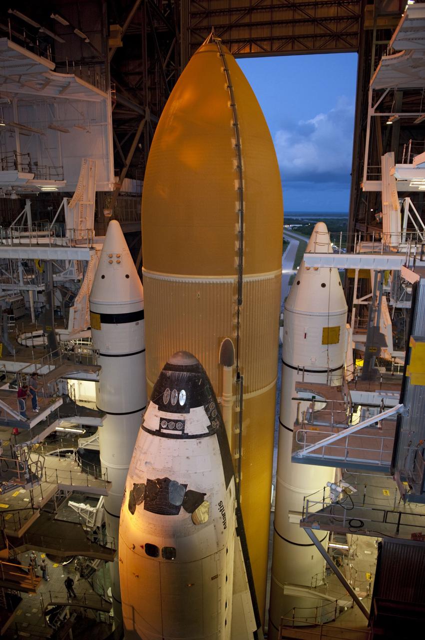 CAPE CANAVERAL, Fla. -- Space shuttle Atlantis, attached to its external fuel tank and solid rocket boosters atop a mobile launcher platform, awaits its final journey from the Vehicle Assembly Building to Launch Pad 39A at NASA's Kennedy Space Center in Florida. "Rollout," as it's called, began at 8:42 p.m. EDT. It will take the crawler-transporter about six hours to carry the shuttle stack to its seaside launch pad. The milestone move paves the way for the launch of the STS-135 mission to the International Space Station, targeted for July 8.        STS-135 will be the 33rd flight of Atlantis, the 37th shuttle mission to the space station, and the 135th and final mission of NASA's Space Shuttle Program. For more information visit, www.nasa.gov/mission_pages/shuttle/shuttlemissions/sts135/index.html. Photo credit: NASA/Kim Shiflett
