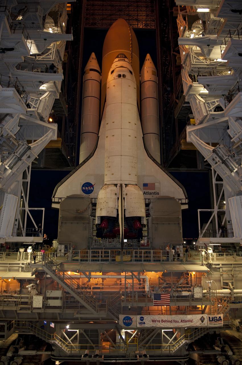 CAPE CANAVERAL, Fla. -- Space shuttle Atlantis, attached to its external fuel tank and solid rocket boosters atop a mobile launcher platform, slowly inches out of the Vehicle Assembly Building for the final time. "Rollout," as it's called, to Launch Pad 39A at NASA's Kennedy Space Center in Florida began at 8:42 p.m. EDT. It will take the crawler-transporter about six hours to carry the shuttle stack to its seaside launch pad. The milestone move paves the way for the launch of the STS-135 mission to the International Space Station, targeted for July 8.    STS-135 will be the 33rd flight of Atlantis, the 37th shuttle mission to the space station, and the 135th and final mission of NASA's Space Shuttle Program. For more information visit, www.nasa.gov/mission_pages/shuttle/shuttlemissions/sts135/index.html. Photo credit: NASA/Kim Shiflett