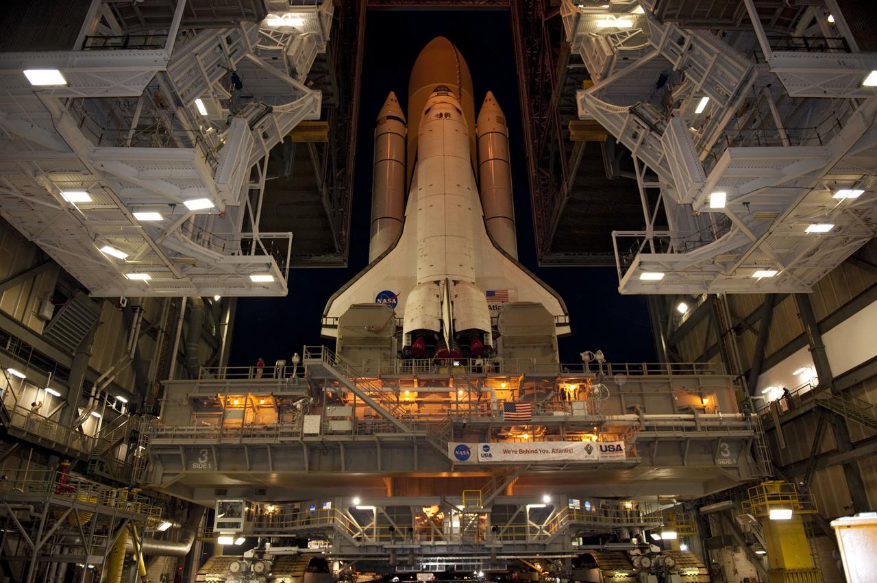 CAPE CANAVERAL, Fla. -- Space shuttle Atlantis, attached to its external fuel tank and solid rocket boosters atop a mobile launcher platform, makes its final debut outside the Vehicle Assembly Building. "Rollout," as it's called, to Launch Pad 39A at NASA's Kennedy Space Center in Florida began at 8:42 p.m. EDT. It will take the crawler-transporter about six hours to carry the shuttle stack to its seaside launch pad. The milestone move paves the way for the launch of the STS-135 mission to the International Space Station, targeted for July 8.          STS-135 will be the 33rd flight of Atlantis, the 37th shuttle mission to the space station, and the 135th and final mission of NASA's Space Shuttle Program. For more information visit, www.nasa.gov/mission_pages/shuttle/shuttlemissions/sts135/index.html. Photo credit: NASA/Kim Shiflett