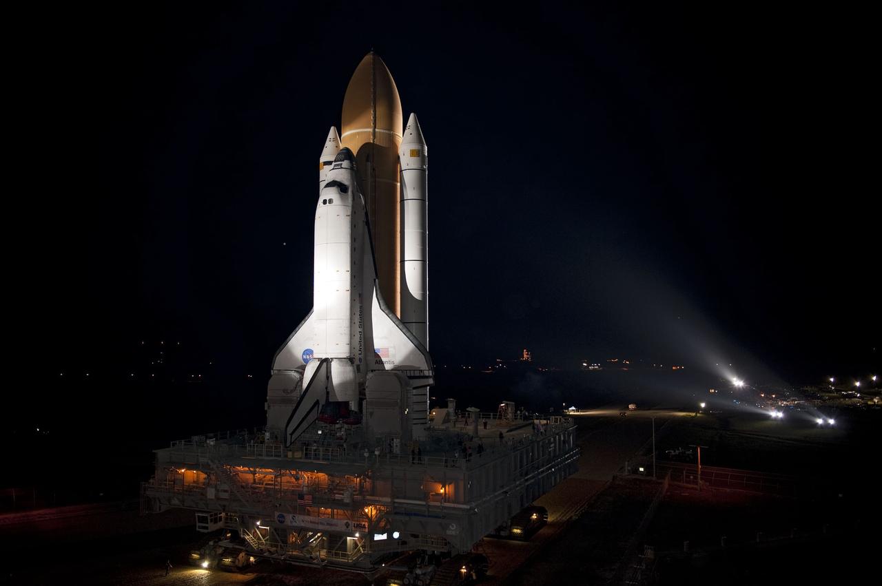CAPE CANAVERAL, Fla. -- Bathed in xenon lights, space shuttle Atlantis embarks on its final journey from the Vehicle Assembly Building to Launch Pad 39A at NASA's Kennedy Space Center in Florida. First motion was at 8:42 p.m. EDT. It will take the crawler-transporter about six hours to carry the shuttle, attached to its external fuel tank and solid rocket boosters, to the seaside launch pad. The milestone move paves the way for the launch of the STS-135 mission to the International Space Station, targeted for July 8.        STS-135 will be the 33rd flight of Atlantis, the 37th shuttle mission to the space station, and the 135th and final mission of NASA's Space Shuttle Program. For more information visit, www.nasa.gov/mission_pages/shuttle/shuttlemissions/sts135/index.html. Photo credit: NASA/Kim Shiflett