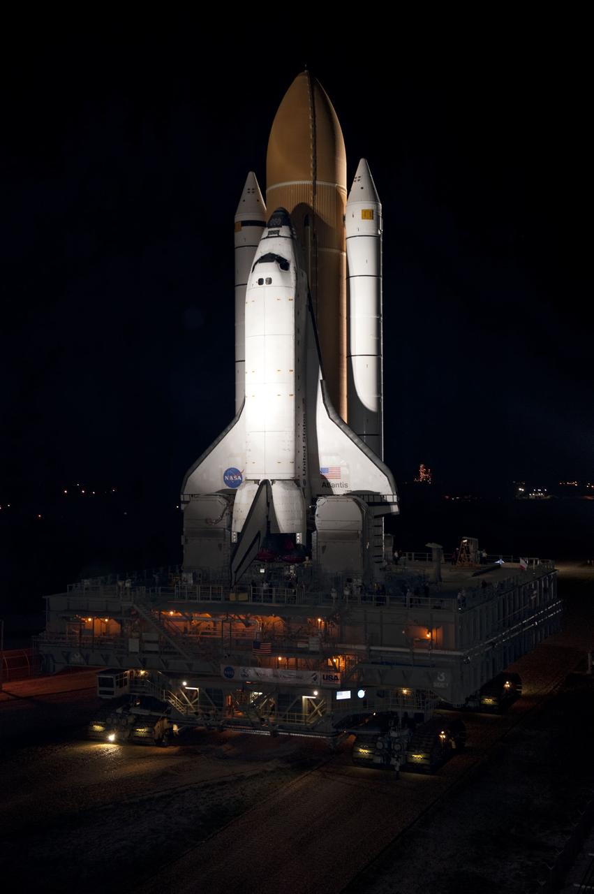 CAPE CANAVERAL, Fla. -- Bathed in xenon lights, space shuttle Atlantis embarks on its final journey from the Vehicle Assembly Building to Launch Pad 39A at NASA's Kennedy Space Center in Florida. First motion was at 8:42 p.m. EDT. It will take the crawler-transporter about six hours to carry the shuttle, attached to its external fuel tank and solid rocket boosters, to the seaside launch pad. The milestone move paves the way for the launch of the STS-135 mission to the International Space Station, targeted for July 8.      STS-135 will be the 33rd flight of Atlantis, the 37th shuttle mission to the space station, and the 135th and final mission of NASA's Space Shuttle Program. For more information visit, www.nasa.gov/mission_pages/shuttle/shuttlemissions/sts135/index.html. Photo credit: NASA/Kim Shiflett