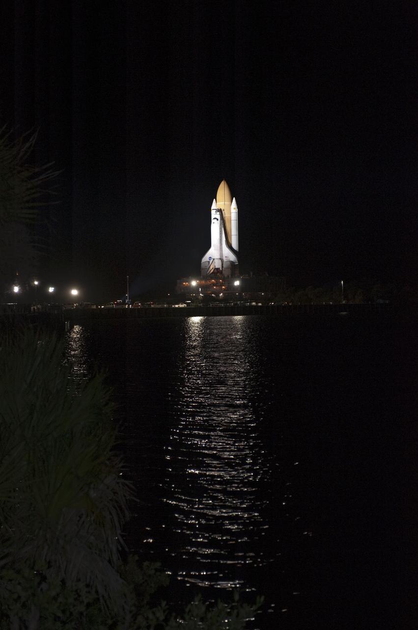 CAPE CANAVERAL, Fla. -- Bathed in xenon lights, space shuttle Atlantis passes the Turn Basin as it makes its final journey from the Vehicle Assembly Building to Launch Pad 39A at NASA's Kennedy Space Center in Florida. First motion was at 8:42 p.m. EDT. It will take the crawler-transporter about six hours to carry the shuttle, attached to its external fuel tank and solid rocket boosters, to the seaside launch pad. The milestone move paves the way for the launch of the STS-135 mission to the International Space Station, targeted for July 8.      STS-135 will be the 33rd flight of Atlantis, the 37th shuttle mission to the space station, and the 135th and final mission of NASA's Space Shuttle Program. For more information visit, www.nasa.gov/mission_pages/shuttle/shuttlemissions/sts135/index.html. Photo credit: NASA/Kim Shiflett