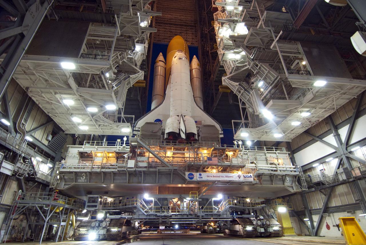 CAPE CANAVERAL, Fla. -- Space shuttle Atlantis, attached to its external fuel tank and solid rocket boosters atop a mobile launcher platform, slowly inches out of the Vehicle Assembly Building for the final time. "Rollout," as it's called, to Launch Pad 39A at NASA's Kennedy Space Center in Florida began at 8:42 p.m. EDT. It will take the crawler-transporter about six hours to carry the shuttle stack to its seaside launch pad. The milestone move paves the way for the launch of the STS-135 mission to the International Space Station, targeted for July 8.      STS-135 will be the 33rd flight of Atlantis, the 37th shuttle mission to the space station, and the 135th and final mission of NASA's Space Shuttle Program. For more information visit, www.nasa.gov/mission_pages/shuttle/shuttlemissions/sts135/index.html. Photo credit: NASA/Jim Grossmann