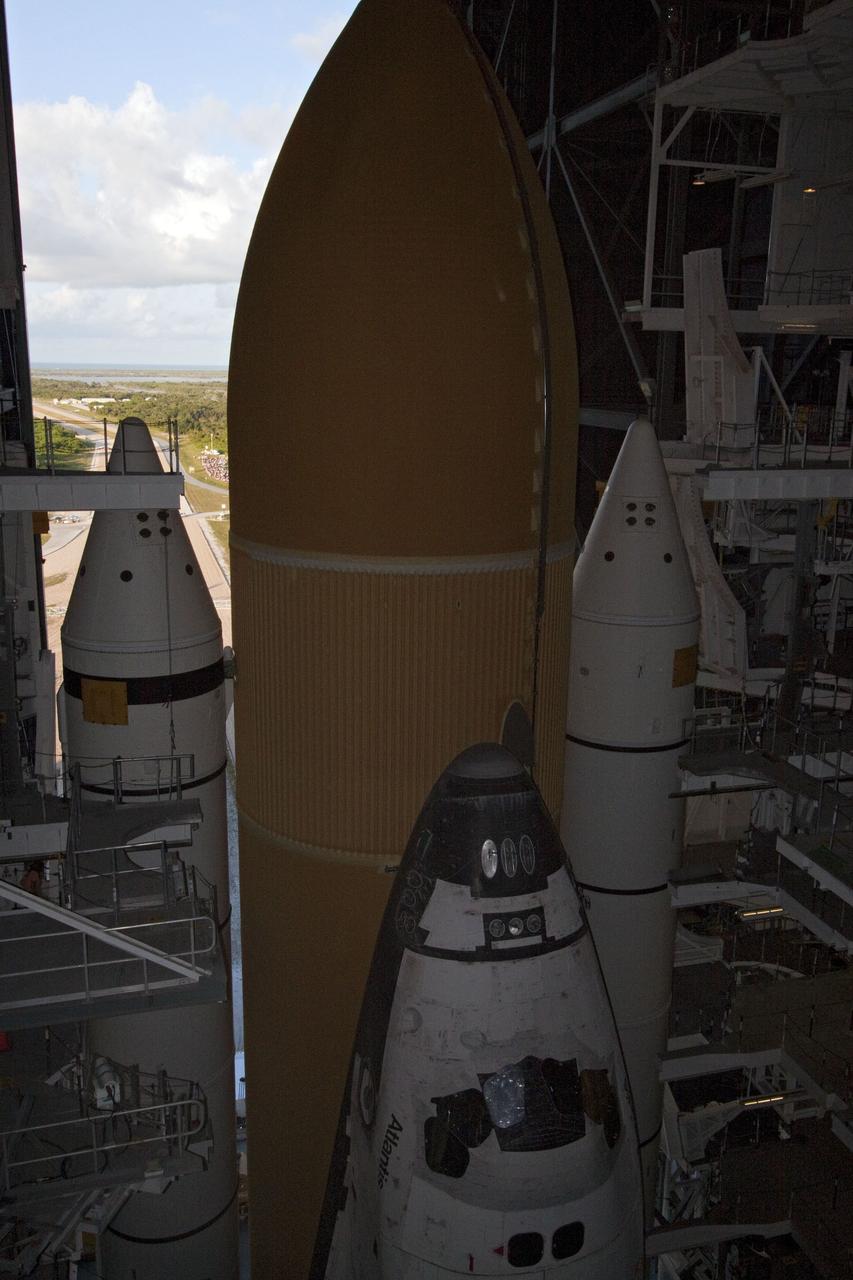 CAPE CANAVERAL, Fla. -- Space shuttle Atlantis, attached to its external fuel tank and solid rocket boosters atop a mobile launcher platform, awaits its final journey from the Vehicle Assembly Building to Launch Pad 39A at NASA's Kennedy Space Center in Florida. "Rollout," as it's called, began at 8:42 p.m. EDT. It will take the crawler-transporter about six hours to carry the shuttle stack to its seaside launch pad. The milestone move paves the way for the launch of the STS-135 mission to the International Space Station, targeted for July 8.        STS-135 will be the 33rd flight of Atlantis, the 37th shuttle mission to the space station, and the 135th and final mission of NASA's Space Shuttle Program. For more information visit, www.nasa.gov/mission_pages/shuttle/shuttlemissions/sts135/index.html. Photo credit: NASA/Jack Pfaller