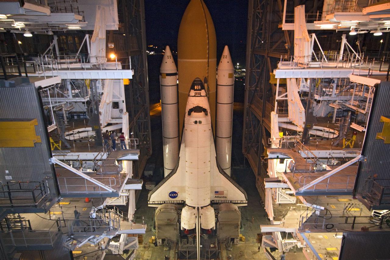 CAPE CANAVERAL, Fla. -- Space shuttle Atlantis, attached to its external fuel tank and solid rocket boosters atop a mobile launcher platform, slowly inches out of the Vehicle Assembly Building for the final time. "Rollout," as it's called, to Launch Pad 39A at NASA's Kennedy Space Center in Florida began at 8:42 p.m. EDT. It will take the crawler-transporter about six hours to carry the shuttle stack to its seaside launch pad. The milestone move paves the way for the launch of the STS-135 mission to the International Space Station, targeted for July 8.        STS-135 will be the 33rd flight of Atlantis, the 37th shuttle mission to the space station, and the 135th and final mission of NASA's Space Shuttle Program. For more information visit, www.nasa.gov/mission_pages/shuttle/shuttlemissions/sts135/index.html. Photo credit: NASA/Jack Pfaller