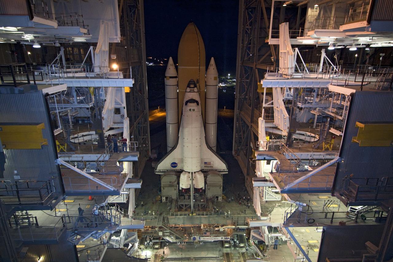 CAPE CANAVERAL, Fla. -- Space shuttle Atlantis, attached to its external fuel tank and solid rocket boosters atop a mobile launcher platform, slowly inches out of the Vehicle Assembly Building for the final time. "Rollout," as it's called, to Launch Pad 39A at NASA's Kennedy Space Center in Florida began at 8:42 p.m. EDT. It will take the crawler-transporter about six hours to carry the shuttle stack to its seaside launch pad. The milestone move paves the way for the launch of the STS-135 mission to the International Space Station, targeted for July 8.      STS-135 will be the 33rd flight of Atlantis, the 37th shuttle mission to the space station, and the 135th and final mission of NASA's Space Shuttle Program. For more information visit, www.nasa.gov/mission_pages/shuttle/shuttlemissions/sts135/index.html. Photo credit: NASA/Jack Pfaller