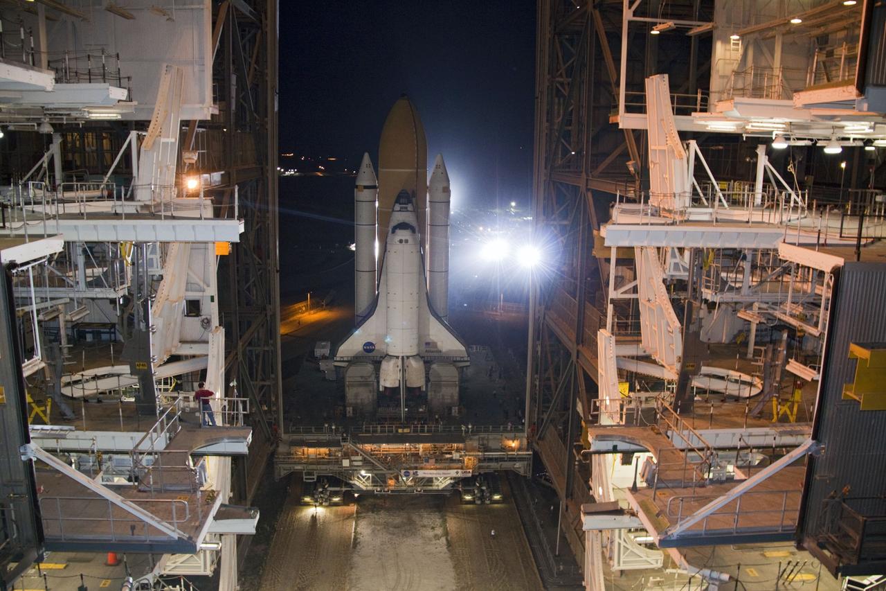 CAPE CANAVERAL, Fla. -- Bright xenon lights greet space shuttle Atlantis as the vehicle makes its final debut outside the Vehicle Assembly Building. "Rollout," as it's called, to Launch Pad 39A at NASA's Kennedy Space Center in Florida began at 8:42 p.m. EDT. It will take the crawler-transporter about six hours to carry the shuttle, attached to its external fuel tank and solid rocket boosters atop a mobile launcher platform, to its seaside launch pad. The milestone move paves the way for the launch of the STS-135 mission to the International Space Station, targeted for July 8.    STS-135 will be the 33rd flight of Atlantis, the 37th shuttle mission to the space station, and the 135th and final mission of NASA's Space Shuttle Program. For more information visit, www.nasa.gov/mission_pages/shuttle/shuttlemissions/sts135/index.html. Photo credit: NASA/Jack Pfaller