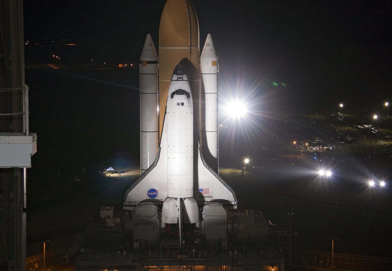 CAPE CANAVERAL, Fla. -- Bright xenon lights greet space shuttle Atlantis as the vehicle makes its final debut outside the Vehicle Assembly Building. "Rollout," as it's called, to Launch Pad 39A at NASA's Kennedy Space Center in Florida began at 8:42 p.m. EDT. It will take the crawler-transporter about six hours to carry the shuttle, attached to its external fuel tank and solid rocket boosters atop a mobile launcher platform, to its seaside launch pad. The milestone move paves the way for the launch of the STS-135 mission to the International Space Station, targeted for July 8.      STS-135 will be the 33rd flight of Atlantis, the 37th shuttle mission to the space station, and the 135th and final mission of NASA's Space Shuttle Program. For more information visit, www.nasa.gov/mission_pages/shuttle/shuttlemissions/sts135/index.html. Photo credit: NASA/Jack Pfaller