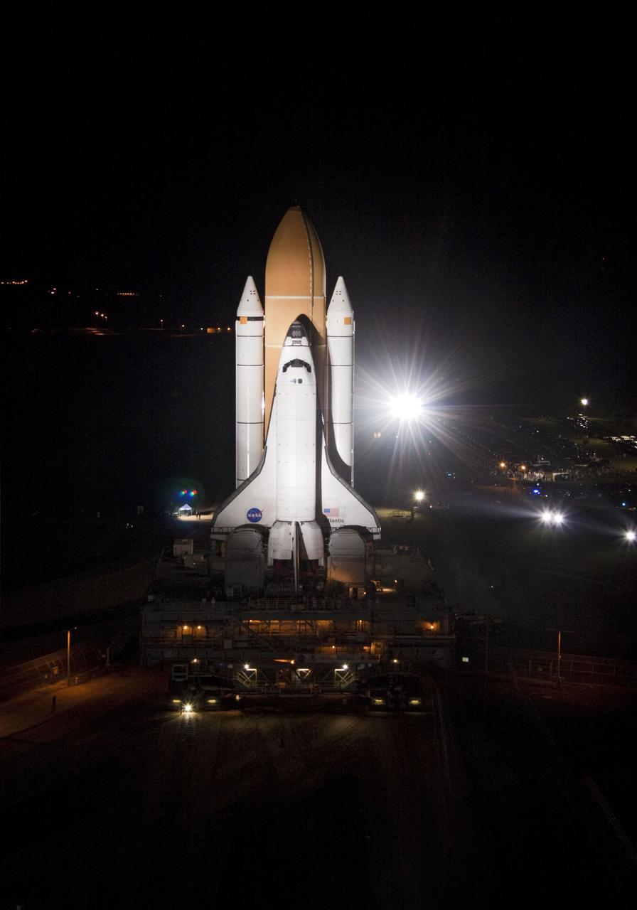CAPE CANAVERAL, Fla. -- Bright xenon lights usher space shuttle Atlantis down a 3.4-mile stretch of river rocks as the vehicle embarks on its historic final journey from the Vehicle Assembly Building to Launch Pad 39A at NASA's Kennedy Space Center in Florida. "Rollout," as it's called, began at 8:42 p.m. EDT. It will take the crawler-transporter about six hours to carry Atlantis, attached to its external fuel tank and solid rocket boosters atop a mobile launcher platform, to the seaside launch pad. The milestone move paves the way for the launch of the STS-135 mission to the International Space Station, targeted for July 8.        STS-135 will be the 33rd flight of Atlantis, the 37th shuttle mission to the space station, and the 135th and final mission of NASA's Space Shuttle Program. For more information visit, www.nasa.gov/mission_pages/shuttle/shuttlemissions/sts135/index.html. Photo credit: NASA/Jack Pfaller