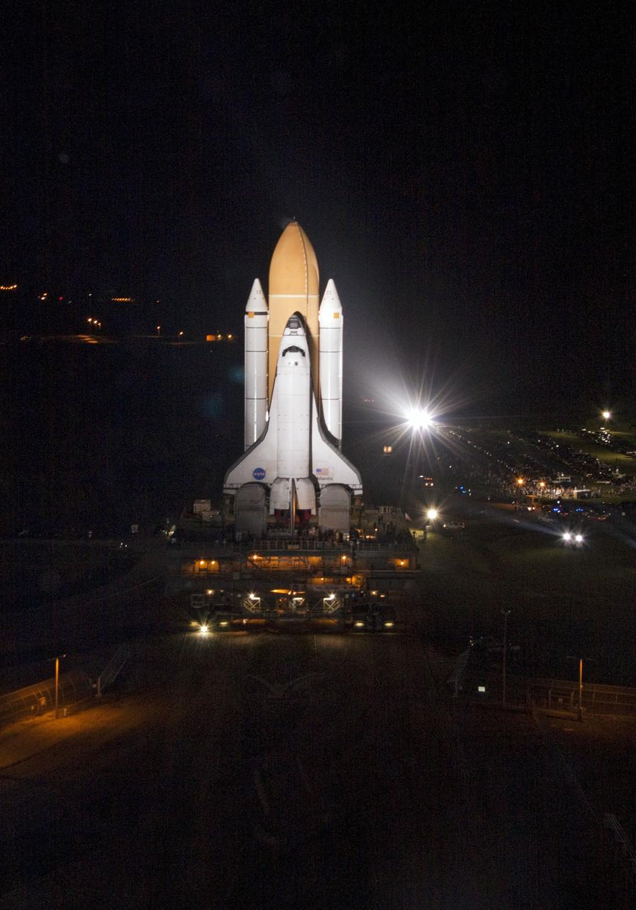 CAPE CANAVERAL, Fla. -- Bright xenon lights usher space shuttle Atlantis down a 3.4-mile stretch of river rocks as the vehicle embarks on its historic final journey from the Vehicle Assembly Building to Launch Pad 39A at NASA's Kennedy Space Center in Florida. "Rollout," as it's called, began at 8:42 p.m. EDT. It will take the crawler-transporter about six hours to carry Atlantis, attached to its external fuel tank and solid rocket boosters atop a mobile launcher platform, to the seaside launch pad. The milestone move paves the way for the launch of the STS-135 mission to the International Space Station, targeted for July 8.      STS-135 will be the 33rd flight of Atlantis, the 37th shuttle mission to the space station, and the 135th and final mission of NASA's Space Shuttle Program. For more information visit, www.nasa.gov/mission_pages/shuttle/shuttlemissions/sts135/index.html. Photo credit: NASA/Jack Pfaller