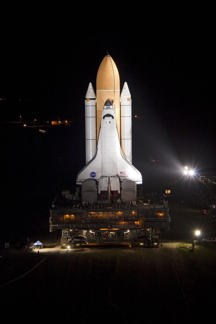 CAPE CANAVERAL, Fla. -- Bright xenon lights usher space shuttle Atlantis down a 3.4-mile stretch of river rocks as the vehicle embarks on its historic final journey from the Vehicle Assembly Building to Launch Pad 39A at NASA's Kennedy Space Center in Florida. "Rollout," as it's called, began at 8:42 p.m. EDT. It will take the crawler-transporter about six hours to carry Atlantis, attached to its external fuel tank and solid rocket boosters atop a mobile launcher platform, to the seaside launch pad. The milestone move paves the way for the launch of the STS-135 mission to the International Space Station, targeted for July 8.    STS-135 will be the 33rd flight of Atlantis, the 37th shuttle mission to the space station, and the 135th and final mission of NASA's Space Shuttle Program. For more information visit, www.nasa.gov/mission_pages/shuttle/shuttlemissions/sts135/index.html. Photo credit: NASA/Jack Pfaller