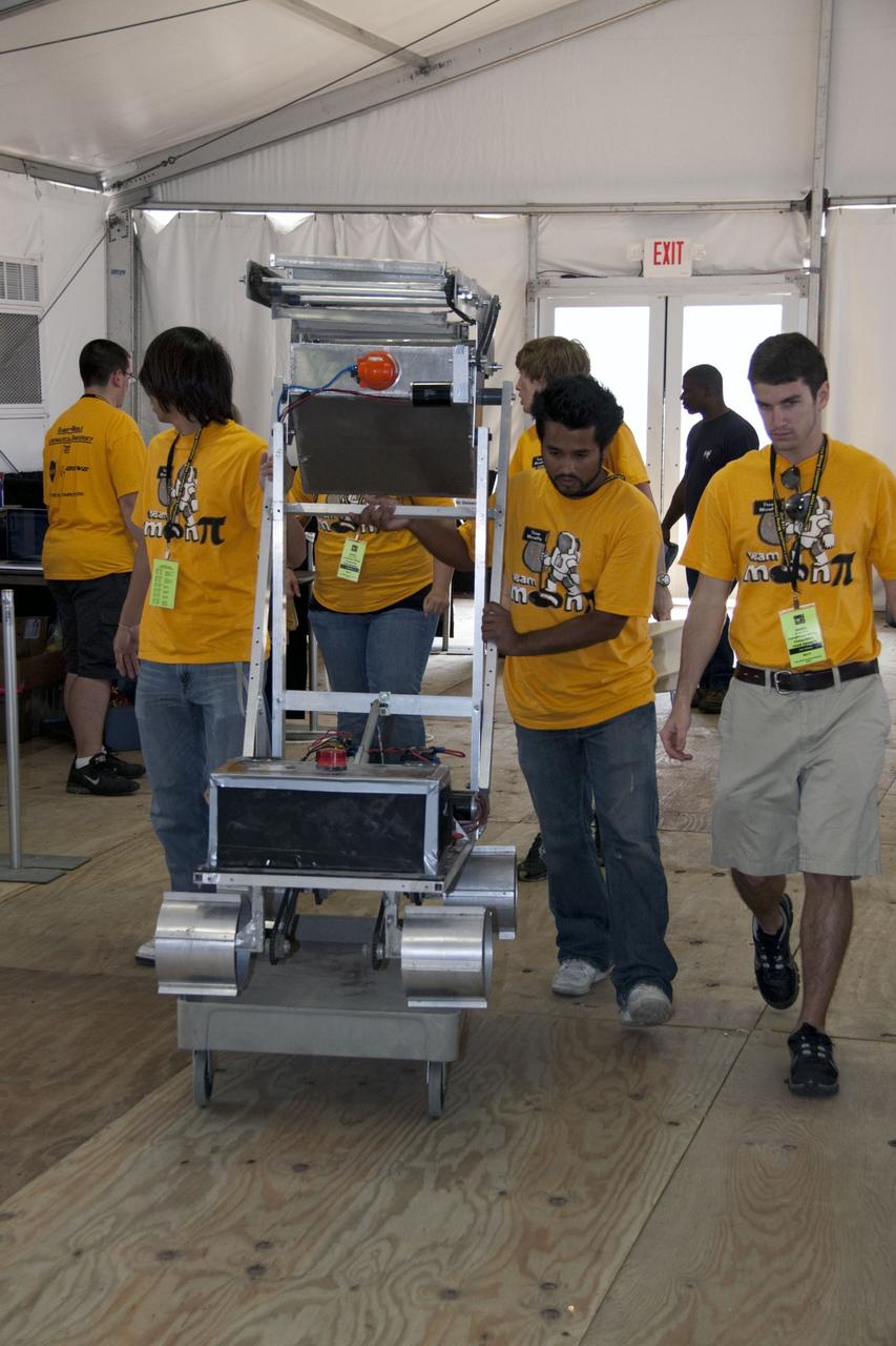CAPE CANAVERAL, Fla. -- University students make final preparations for NASA's second annual Lunabotics Mining Competition held at the Kennedy Space Center Visitor Complex in Florida.        Thirty-six teams of undergraduate and graduate students from the United States, Bangladesh, Canada, Colombia and India will participate in NASA's Lunabotics Mining Competition May 26 - 28 at the agency's Kennedy Space Center in Florida. The competition is designed to engage and retain students in science, technology, engineering and mathematics (STEM). Teams will maneuver their remote controlled or autonomous excavators, called lunabots, in about 60 tons of ultra-fine simulated lunar soil, called BP-1. The competition is an Exploration Systems Mission Directorate project managed by Kennedy's Education Division. The event also provides a competitive environment that could result in innovative ideas and solutions for NASA's future excavation of the moon. Photo credit: NASA/Jack Pfaller
