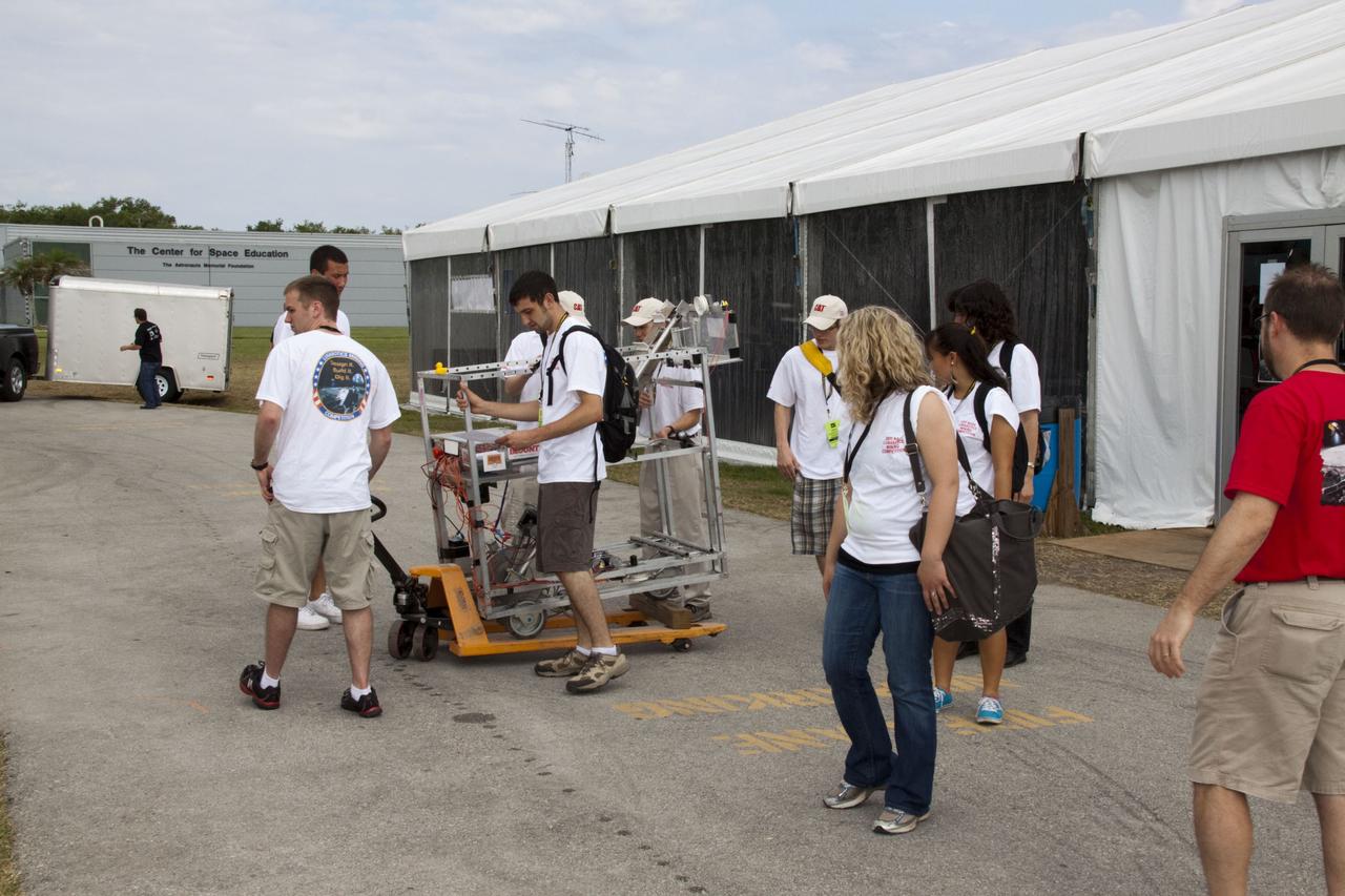 CAPE CANAVERAL, Fla. -- University students make final preparations for NASA's second annual Lunabotics Mining Competition held at the Kennedy Space Center Visitor Complex in Florida.        Thirty-six teams of undergraduate and graduate students from the United States, Bangladesh, Canada, Colombia and India will participate in NASA's Lunabotics Mining Competition May 26 - 28 at the agency's Kennedy Space Center in Florida. The competition is designed to engage and retain students in science, technology, engineering and mathematics (STEM). Teams will maneuver their remote controlled or autonomous excavators, called lunabots, in about 60 tons of ultra-fine simulated lunar soil, called BP-1. The competition is an Exploration Systems Mission Directorate project managed by Kennedy's Education Division. The event also provides a competitive environment that could result in innovative ideas and solutions for NASA's future excavation of the moon. Photo credit: NASA/Jack Pfaller
