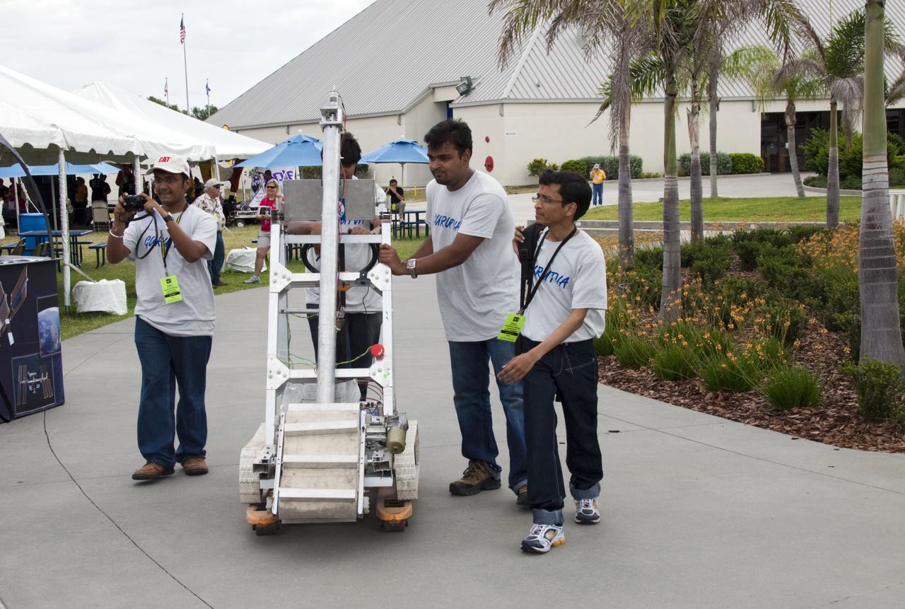 CAPE CANAVERAL, Fla. -- University students make final preparations for NASA's second annual Lunabotics Mining Competition held at the Kennedy Space Center Visitor Complex in Florida.           Thirty-six teams of undergraduate and graduate students from the United States, Bangladesh, Canada, Colombia and India will participate in NASA's Lunabotics Mining Competition May 26 - 28 at the agency's Kennedy Space Center in Florida. The competition is designed to engage and retain students in science, technology, engineering and mathematics (STEM). Teams will maneuver their remote controlled or autonomous excavators, called lunabots, in about 60 tons of ultra-fine simulated lunar soil, called BP-1. The competition is an Exploration Systems Mission Directorate project managed by Kennedy's Education Division. The event also provides a competitive environment that could result in innovative ideas and solutions for NASA's future excavation of the moon. Photo credit: NASA/Jack Pfaller