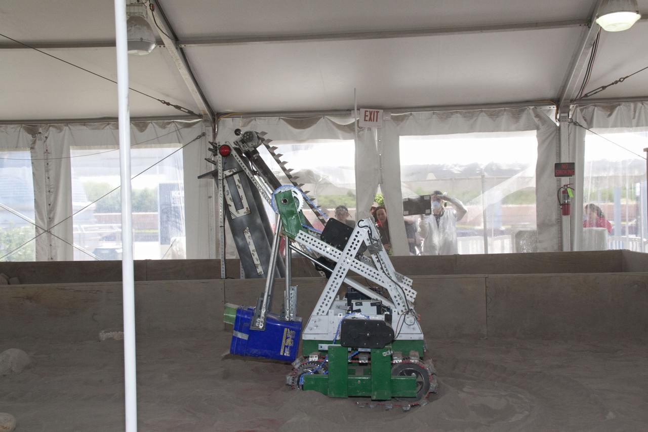CAPE CANAVERAL, Fla. -- Inside the "Lunarena" at the Kennedy Space Center Visitor Complex in Florida, university students maneuver their remote controlled or autonomous excavators, called lunabots, in a "sand box" of ultra-fine simulated lunar soil during NASA's second annual Lunabotics Mining Competition. Thirty-six teams of undergraduate and graduate students from the United States, Bangladesh, Canada, Colombia and India will participate in NASA's Lunabotics Mining Competition May 26 - 28 at the agency's Kennedy Space Center in Florida. The competition is designed to engage and retain students in science, technology, engineering and mathematics (STEM). Teams will maneuver their remote controlled or autonomous excavators, called lunabots, in about 60 tons of ultra-fine simulated lunar soil, called BP-1. The competition is an Exploration Systems Mission Directorate project managed by Kennedy's Education Division. The event also provides a competitive environment that could result in innovative ideas and solutions for NASA's future excavation of the moon. Photo credit: NASA/Jack Pfaller