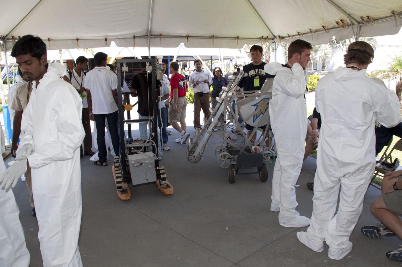 CAPE CANAVERAL, Fla. -- University students wait their turn to compete in NASA's second annual Lunabotics Mining Competition at the Kennedy Space Center Visitor Complex in Florida. Thirty-six teams of undergraduate and graduate students from the United States, Bangladesh, Canada, Colombia and India will participate in NASA's Lunabotics Mining Competition May 26 - 28 at the agency's Kennedy Space Center in Florida. The competition is designed to engage and retain students in science, technology, engineering and mathematics (STEM). Teams will maneuver their remote controlled or autonomous excavators, called lunabots, in about 60 tons of ultra-fine simulated lunar soil, called BP-1. The competition is an Exploration Systems Mission Directorate project managed by Kennedy's Education Division. The event also provides a competitive environment that could result in innovative ideas and solutions for NASA's future excavation of the moon. Photo credit: NASA/Jack Pfaller