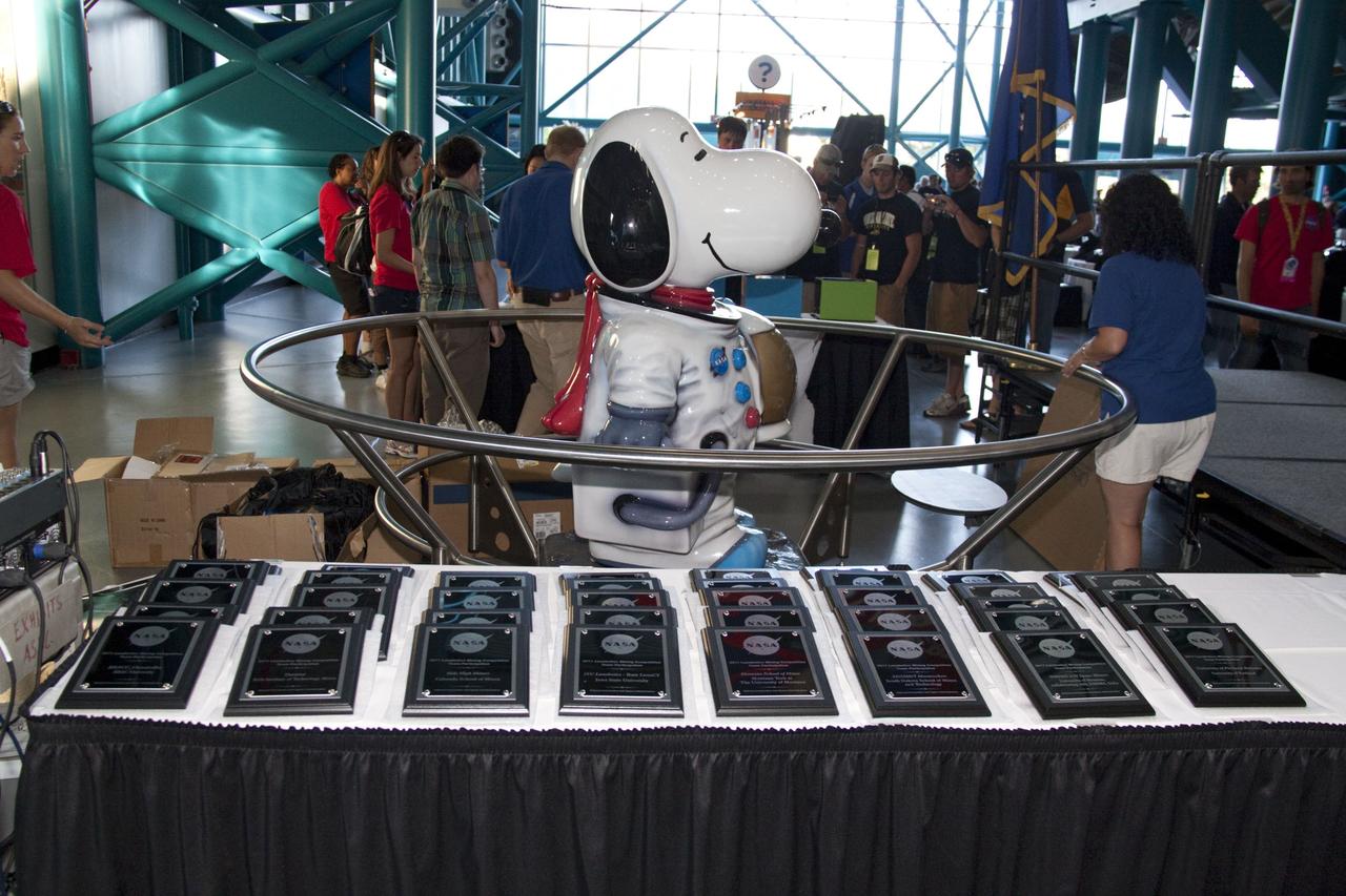 CAPE CANAVERAL, Fla. -- At NASA Kennedy Space Center's Apollo/Saturn V Center, university students take part in an award ceremony for NASA's second annual Lunabotics Mining Competition.              Thirty-six teams of undergraduate and graduate students from the United States, Bangladesh, Canada, Colombia and India participated in NASA's Lunabotics Mining Competition May 26 - 28 at the agency's Kennedy Space Center in Florida. The competition is designed to engage and retain students in science, technology, engineering and mathematics (STEM). Teams will maneuver their remote controlled or autonomous excavators, called lunabots, in about 60 tons of ultra-fine simulated lunar soil, called BP-1. The competition is an Exploration Systems Mission Directorate project managed by Kennedy's Education Division. The event also provides a competitive environment that could result in innovative ideas and solutions for NASA's future excavation of the moon. Photo credit: NASA/Jack Pfaller