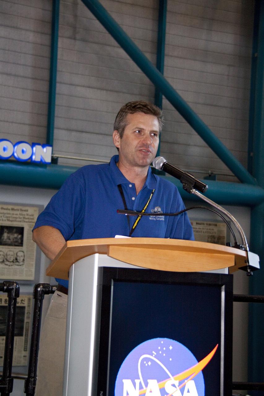 CAPE CANAVERAL, Fla. -- At NASA Kennedy Space Center's Apollo/Saturn V Center, Rob Mueller Kennedy's chief of the Surface Systems Office speaks to university students at the award ceremony for NASA's second annual Lunabotics Mining Competition.          Thirty-six teams of undergraduate and graduate students from the United States, Bangladesh, Canada, Colombia and India participated in NASA's Lunabotics Mining Competition May 26 - 28 at the agency's Kennedy Space Center in Florida. The competition is designed to engage and retain students in science, technology, engineering and mathematics (STEM). Teams will maneuver their remote controlled or autonomous excavators, called lunabots, in about 60 tons of ultra-fine simulated lunar soil, called BP-1. The competition is an Exploration Systems Mission Directorate project managed by Kennedy's Education Division. The event also provides a competitive environment that could result in innovative ideas and solutions for NASA's future excavation of the moon. Photo credit: NASA/Jack Pfaller
