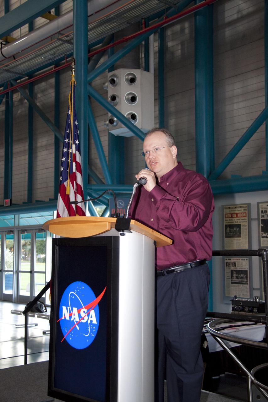 CAPE CANAVERAL, Fla. -- At NASA Kennedy Space Center's Apollo/Saturn V Center, Eric Reiners, manager with the Product Development and Global Technology Division of Caterpillar Inc., speaks to university students at the award ceremony for NASA's second annual Lunabotics Mining Competition. Thirty-six teams of undergraduate and graduate students from the United States, Bangladesh, Canada, Colombia and India participated in NASA's Lunabotics Mining Competition May 26 - 28 at the agency's Kennedy Space Center in Florida. The competition is designed to engage and retain students in science, technology, engineering and mathematics (STEM). Teams will maneuver their remote controlled or autonomous excavators, called lunabots, in about 60 tons of ultra-fine simulated lunar soil, called BP-1. The competition is an Exploration Systems Mission Directorate project managed by Kennedy's Education Division. The event also provides a competitive environment that could result in innovative ideas and solutions for NASA's future excavation of the moon. Photo credit: NASA/Jack Pfaller