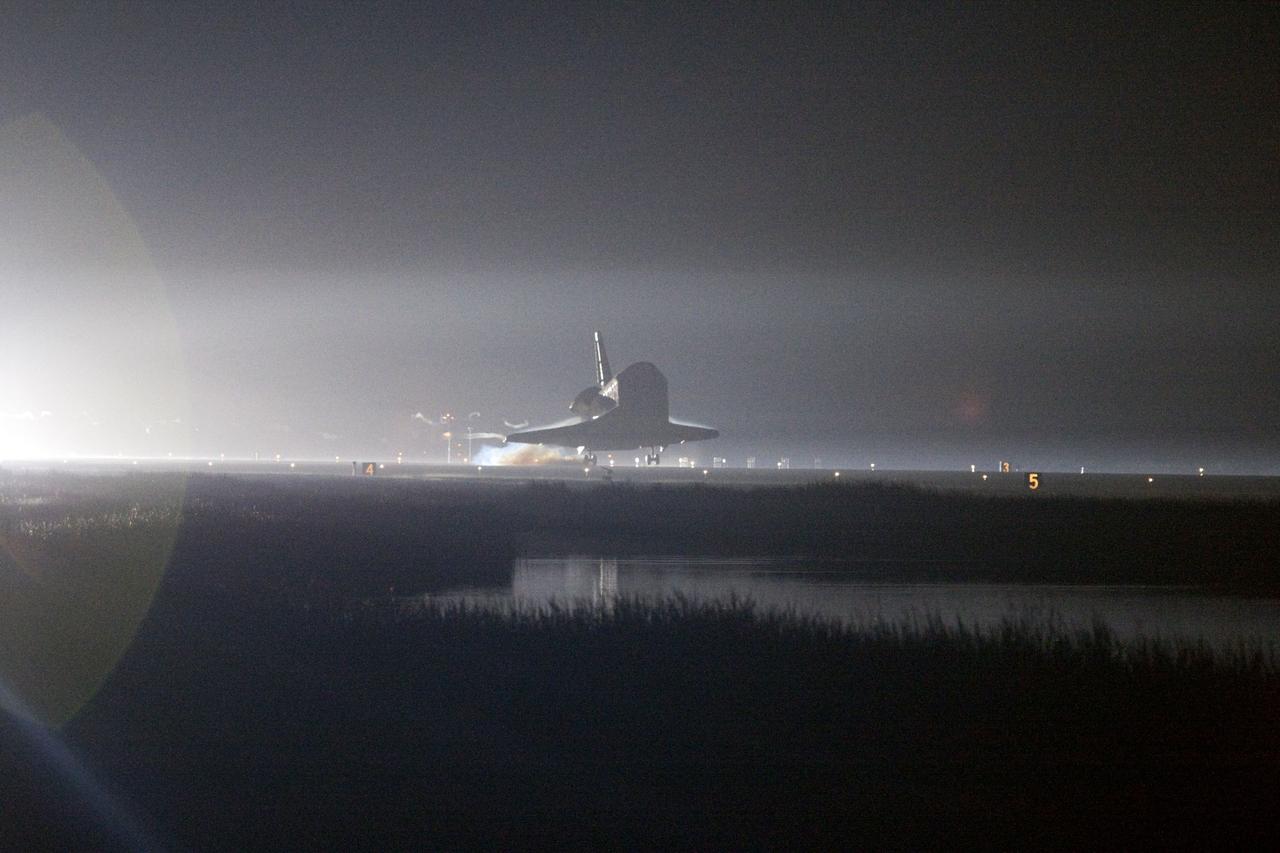 CAPE CANAVERAL, Fla. -- Xenon lights help lead space shuttle Endeavour home to NASA's Kennedy Space Center in Florida. Endeavour landed for the final time on the Shuttle Landing Facility's Runway 15, marking the 25th night landing of NASA's Space Shuttle Program. Main gear touchdown was at 2:34:51 a.m. EDT, followed by nose gear touchdown at 2:35:04 a.m., and wheelstop at 2:35:36 a.m. On board are STS-134 Commander Mark Kelly, Pilot Greg H. Johnson, and Mission Specialists Mike Fincke, Drew Feustel, Greg Chamitoff and the European Space Agency's Roberto Vittori. STS-134 delivered the Alpha Magnetic Spectrometer-2 (AMS) and the Express Logistics Carrier-3 (ELC-3) to the International Space Station. AMS will help researchers understand the origin of the universe and search for evidence of dark matter, strange matter and antimatter from the station. ELC-3 carried spare parts that will sustain station operations once the shuttles are retired from service. STS-134 was the 25th and final flight for Endeavour, which has spent 299 days in space, orbited Earth 4,671 times and traveled 122,883,151 miles. Photo credit: NASA/George Roberto