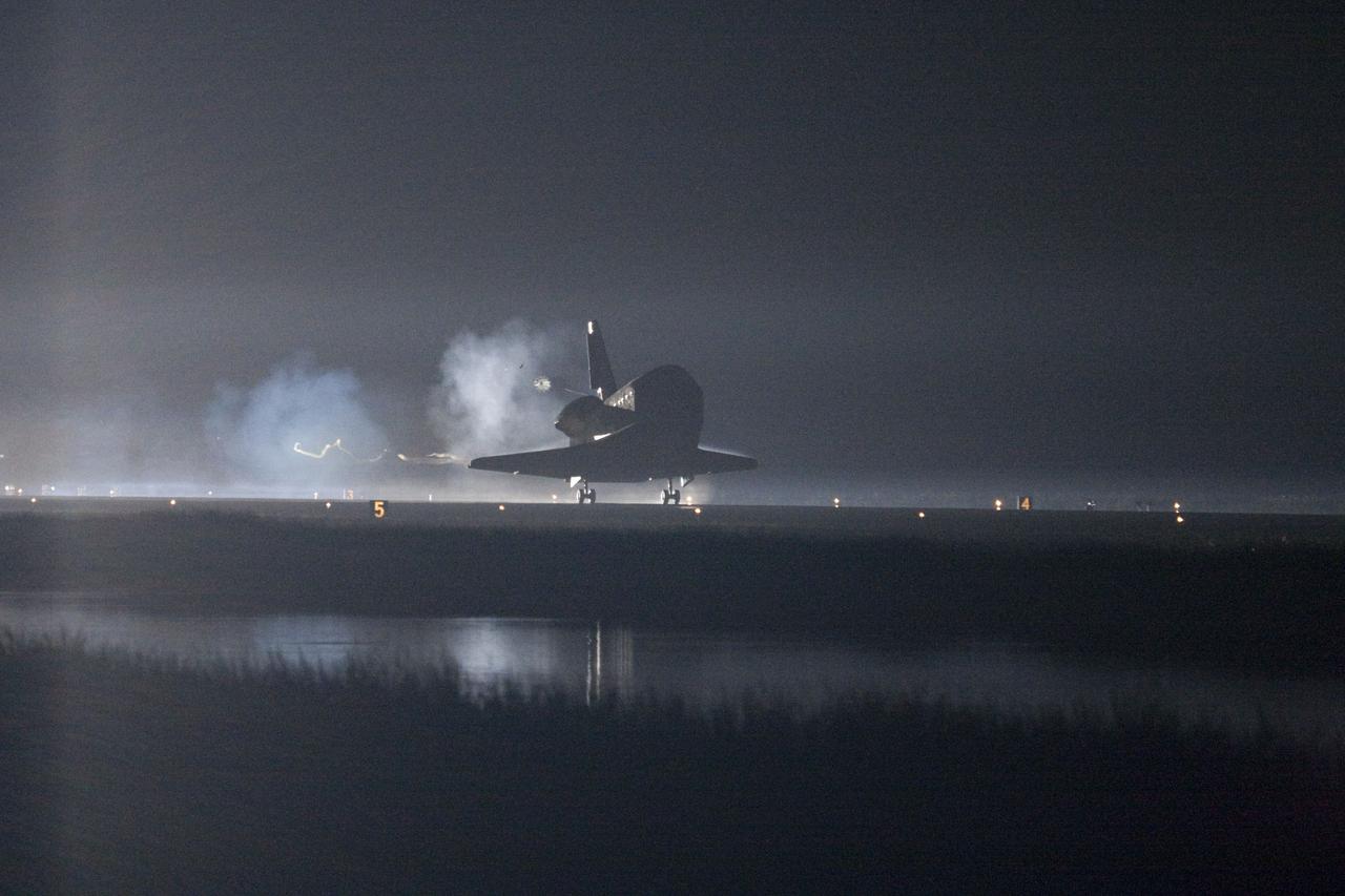 CAPE CANAVERAL, Fla. -- Xenon lights help lead space shuttle Endeavour home to NASA's Kennedy Space Center in Florida. Endeavour landed for the final time on the Shuttle Landing Facility's Runway 15, marking the 25th night landing of NASA's Space Shuttle Program. Main gear touchdown was at 2:34:51 a.m. EDT, followed by nose gear touchdown at 2:35:04 a.m., and wheelstop at 2:35:36 a.m. On board are STS-134 Commander Mark Kelly, Pilot Greg H. Johnson, and Mission Specialists Mike Fincke, Drew Feustel, Greg Chamitoff and the European Space Agency's Roberto Vittori.      STS-134 delivered the Alpha Magnetic Spectrometer-2 (AMS) and the Express Logistics Carrier-3 (ELC-3) to the International Space Station. AMS will help researchers understand the origin of the universe and search for evidence of dark matter, strange matter and antimatter from the station. ELC-3 carried spare parts that will sustain station operations once the shuttles are retired from service. STS-134 was the 25th and final flight for Endeavour, which has spent 299 days in space, orbited Earth 4,671 times and traveled 122,883,151 miles. Photo credit: NASA/George Roberto