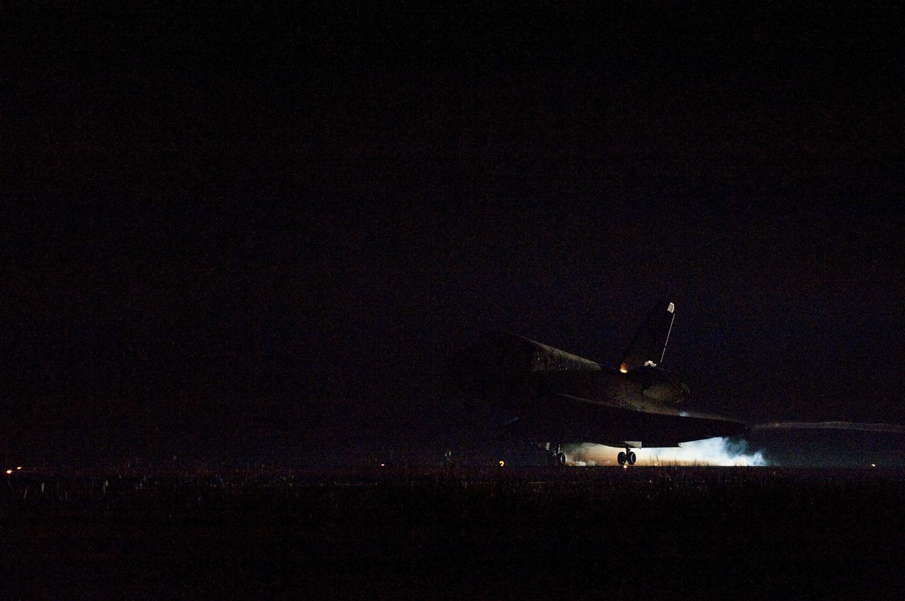 CAPE CANAVERAL, Fla. -- Heat from space shuttle Endeavour's auxiliary power units (APUs), which provide hydraulic control, can be seen at the back of the shuttle, near the vertical tail. Endeavour landed for the final time on the Shuttle Landing Facility's Runway 15 at NASA's Kennedy Space Center in Florida, marking the 25th night landing of the Space Shuttle Program. Main gear touchdown was at 2:34:51 a.m. EDT, followed by nose gear touchdown at 2:35:04 a.m., and wheelstop at 2:35:36 a.m. On board are STS-134 Commander Mark Kelly, Pilot Greg H. Johnson, and Mission Specialists Mike Fincke, Drew Feustel, Greg Chamitoff and the European Space Agency's Roberto Vittori. STS-134 delivered the Alpha Magnetic Spectrometer-2 (AMS) and the Express Logistics Carrier-3 (ELC-3) to the International Space Station. AMS will help researchers understand the origin of the universe and search for evidence of dark matter, strange matter and antimatter from the station. ELC-3 carried spare parts that will sustain station operations once the shuttles are retired from service. STS-134 was the 25th and final flight for Endeavour, which has spent 299 days in space, orbited Earth 4,671 times and traveled 122,883,151 miles. Photo credit: NASA/Tom Farrar