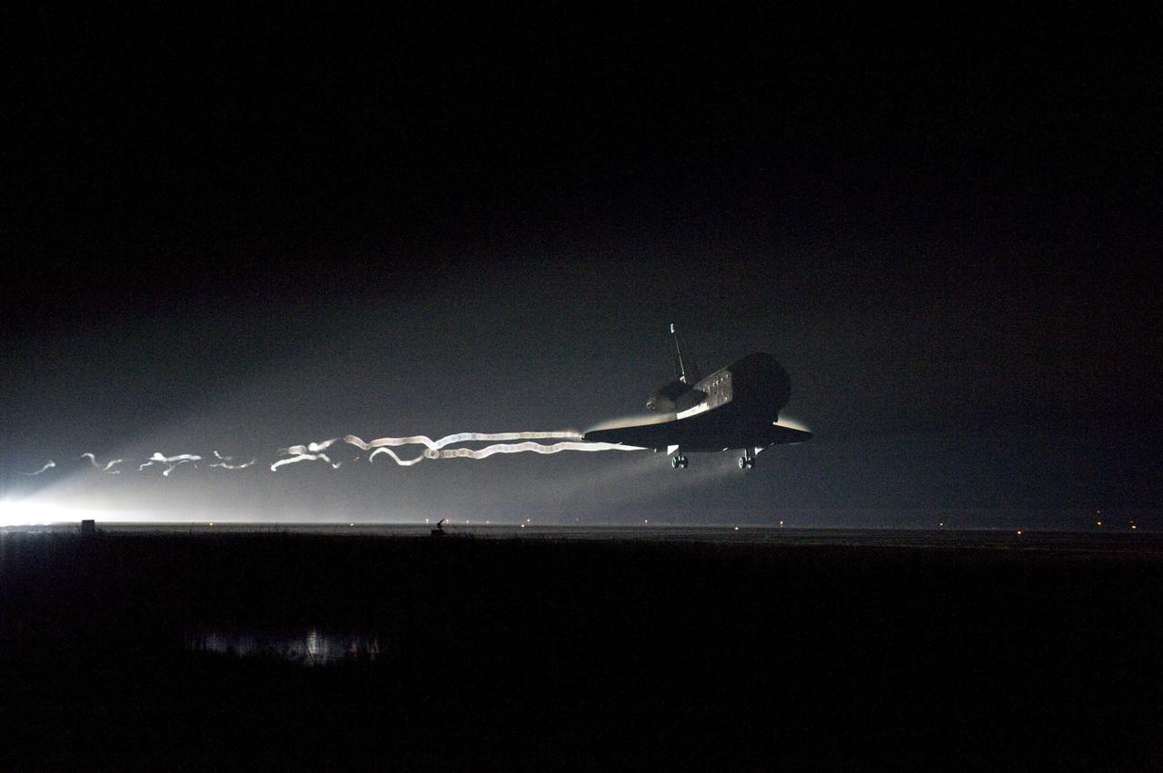 CAPE CANAVERAL, Fla. -- Vapor trails follow space shuttle Endeavour as it approaches Runway 15 on the Shuttle Landing Facility at NASA's Kennedy Space Center in Florida for the final time. A vapor trail, known as a contrail, is a cloud of water vapor that condenses and freezes around the small particles in aircraft exhaust. Main gear touchdown was at 2:34:51 a.m. EDT, followed by nose gear touchdown at 2:35:04 a.m., and wheelstop at 2:35:36 a.m. On board are STS-134 Commander Mark Kelly, Pilot Greg H. Johnson, and Mission Specialists Mike Fincke, Drew Feustel, Greg Chamitoff and the European Space Agency's Roberto Vittori.    STS-134 delivered the Alpha Magnetic Spectrometer-2 (AMS) and the Express Logistics Carrier-3 (ELC-3) to the International Space Station. AMS will help researchers understand the origin of the universe and search for evidence of dark matter, strange matter and antimatter from the station. ELC-3 carried spare parts that will sustain station operations once the shuttles are retired from service. STS-134 was the 25th and final flight for Endeavour, which has spent 299 days in space, orbited Earth 4,671 times and traveled 122,883,151 miles. Photo credit: NASA/Kevin O'Connell