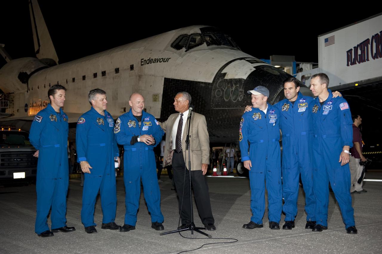 CAPE CANAVERAL, Fla. -- NASA Administrator Charlie Bolden congratulates the STS-134 crew on a job well done following the successful landing of space shuttle Endeavour at NASA's Kennedy Space Center in Florida. From left, are the European Space Agency's Roberto Vittori, Pilot Greg H. Johnson, Commander Mark Kelly, Bolden, and Mission Specialists Mike Fincke, Greg Chamitoff and Drew Feustel. The crew returned to Earth at 2:35 a.m. EDT on the Shuttle Landing Facility's Runway 15, completing a 16-day, 6.5-million mile journey to the International Space Station. STS-134 delivered the Alpha Magnetic Spectrometer-2 (AMS) and the Express Logistics Carrier-3 (ELC-3) to the International Space Station. AMS will help researchers understand the origin of the universe and search for evidence of dark matter, strange matter and antimatter from the station. ELC-3 carried spare parts that will sustain station operations once the shuttles are retired from service. STS-134 was the 25th and final flight for Endeavour, which spent 299 days in space, orbited Earth 4,671 times and traveled 122,883,151 miles. Photo credit: NASA/Kim Shiflett