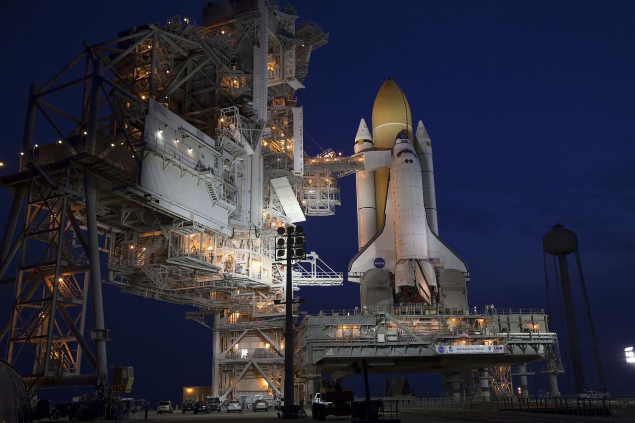 CAPE CANAVERAL, Fla. -- Dawn approaches after space shuttle Atlantis completed its historic final journey to Launch Pad 39A from NASA Kennedy Space Center's Vehicle Assembly Building. Atlantis was secured or "hard down," at its seaside launch pad at 3:29 a.m. EDT on Wednesday, June 1.        The milestone move, known as "rollout," paves the way for the launch of the STS-135 mission to the International Space Station, targeted for July 8. STS-135 will be the 33rd flight of Atlantis, the 37th shuttle mission to the space station, and the 135th and final mission of NASA's Space Shuttle Program. For more information visit: www.nasa.gov/mission_pages/shuttle/shuttlemissions/sts135/index.html. Photo credit: NASA/Terry Zaperach