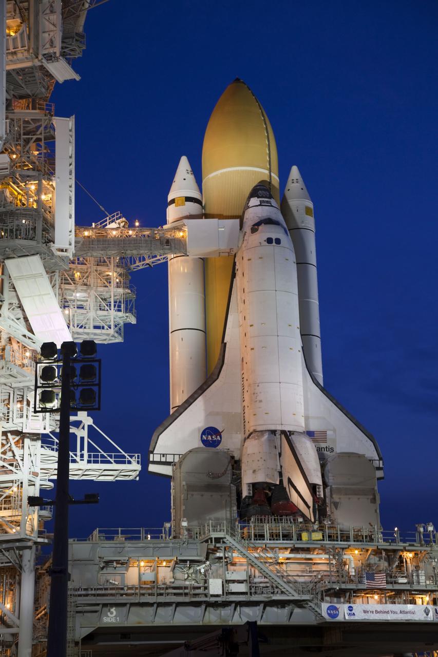 CAPE CANAVERAL, Fla. -- Dawn approaches after space shuttle Atlantis completed its historic final journey to Launch Pad 39A from NASA Kennedy Space Center's Vehicle Assembly Building. Atlantis was secured or "hard down," at its seaside launch pad at 3:29 a.m. EDT on Wednesday, June 1.        The milestone move, known as "rollout," paves the way for the launch of the STS-135 mission to the International Space Station, targeted for July 8. STS-135 will be the 33rd flight of Atlantis, the 37th shuttle mission to the space station, and the 135th and final mission of NASA's Space Shuttle Program. For more information visit: www.nasa.gov/mission_pages/shuttle/shuttlemissions/sts135/index.html. Photo credit: NASA/Terry Zaperach