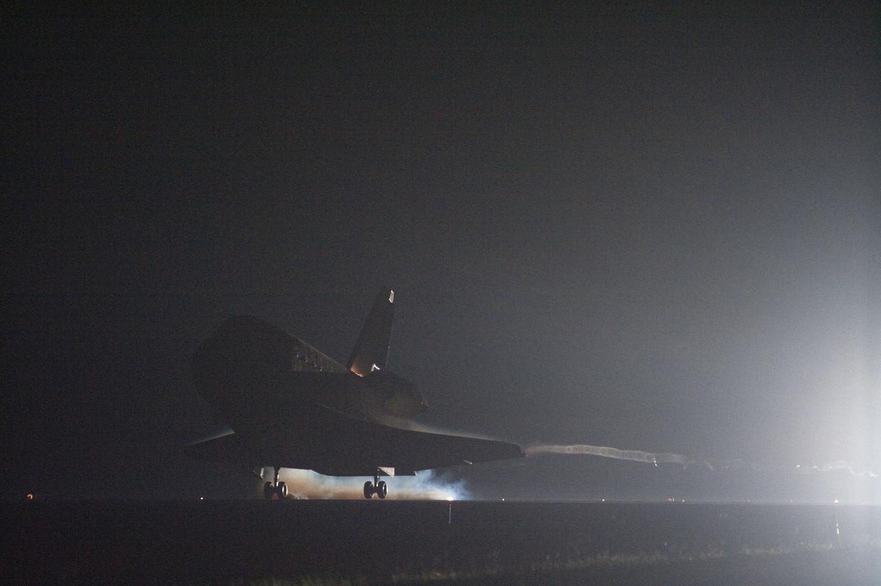 CAPE CANAVERAL, Fla. -- Streams of smoke trail from the main landing gear tires as space shuttle Endeavour touches down on the Shuttle Landing Facility's Runway 15 at NASA's Kennedy Space Center in Florida for the final time marking the 25th night landing of NASA's Space Shuttle Program. Main gear touchdown was at 2:34:51 a.m. EDT, followed by nose gear touchdown at 2:35:04 a.m., and wheelstop at 2:35:36 a.m.           On board are STS-134 Commander Mark Kelly, Pilot Greg H. Johnson, and Mission Specialists Mike Fincke, Drew Feustel, Greg Chamitoff and the European Space Agency's Roberto Vittori. STS-134 delivered the Alpha Magnetic Spectrometer-2 (AMS) and the Express Logistics Carrier-3 (ELC-3) to the International Space Station. AMS will help researchers understand the origin of the universe and search for evidence of dark matter, strange matter and antimatter from the station. ELC-3 carried spare parts that will sustain station operations once the shuttles are retired from service. STS-134 was the 25th and final flight for Endeavour, which has spent 299 days in space, orbited Earth 4,671 times and traveled 122,883,151 miles. Photo credit: NASA/Sandra Joseph and Kevin O'Connell