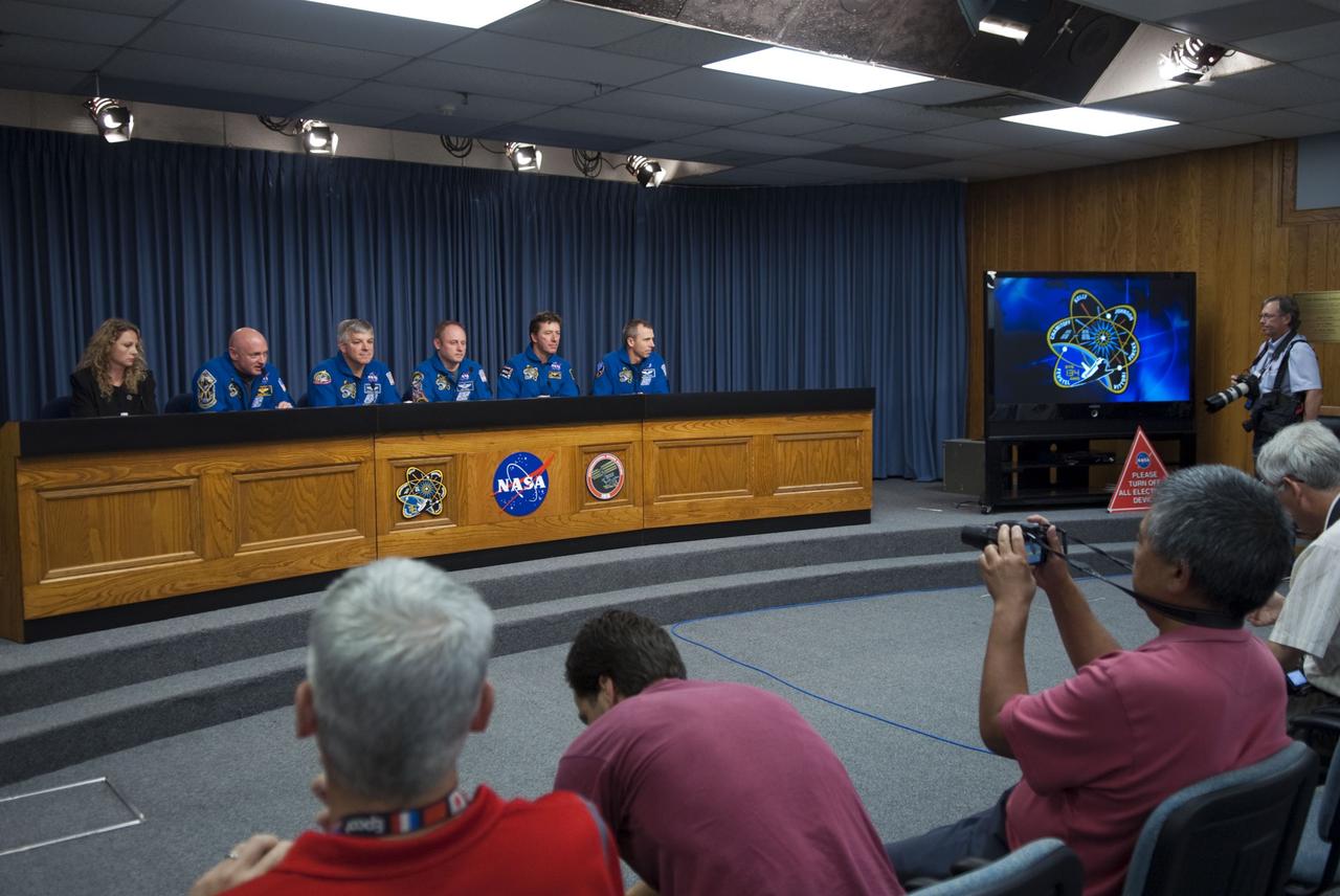 CAPE CANAVERAL, Fla. -- The crew of space shuttle Endeavour's STS-134 mission to the International Space Station participates in a news conference in the Press Site auditorium at NASA's Kennedy Space Center in Florida on landing day. From left are Public Affairs Officer Candrea Thomas,  STS-134 Commander Mark Kelly, Pilot Greg H. Johnson; Mission Specialists Michael Finke, Roberto Vittori, astronaut with the European Space Agency and Andrew Feustel.              Endeavour's final return from space completed the 16-day, 6.5-million-mile STS-134 mission. Main gear touchdown was at 2:34:51 a.m. EDT, followed by nose gear touchdown at 2:35:04 a.m., and wheelstop at 2:35:36 a.m.   Endeavour and its crew delivered the Alpha Magnetic Spectrometer-2 (AMS) and the Express Logistics Carrier-3 (ELC-3) to the International Space Station. AMS will help researchers understand the origin of the universe and search for evidence of dark matter, strange matter and antimatter from the station. ELC-3 carried spare parts that will sustain station operations once the shuttles are retired from service. STS-134 was the 25th and final flight for Endeavour, which spent 299 days in space, orbited Earth 4,671 times and traveled 122,883,151 miles. Photo credit: NASA/Jim Grossmann