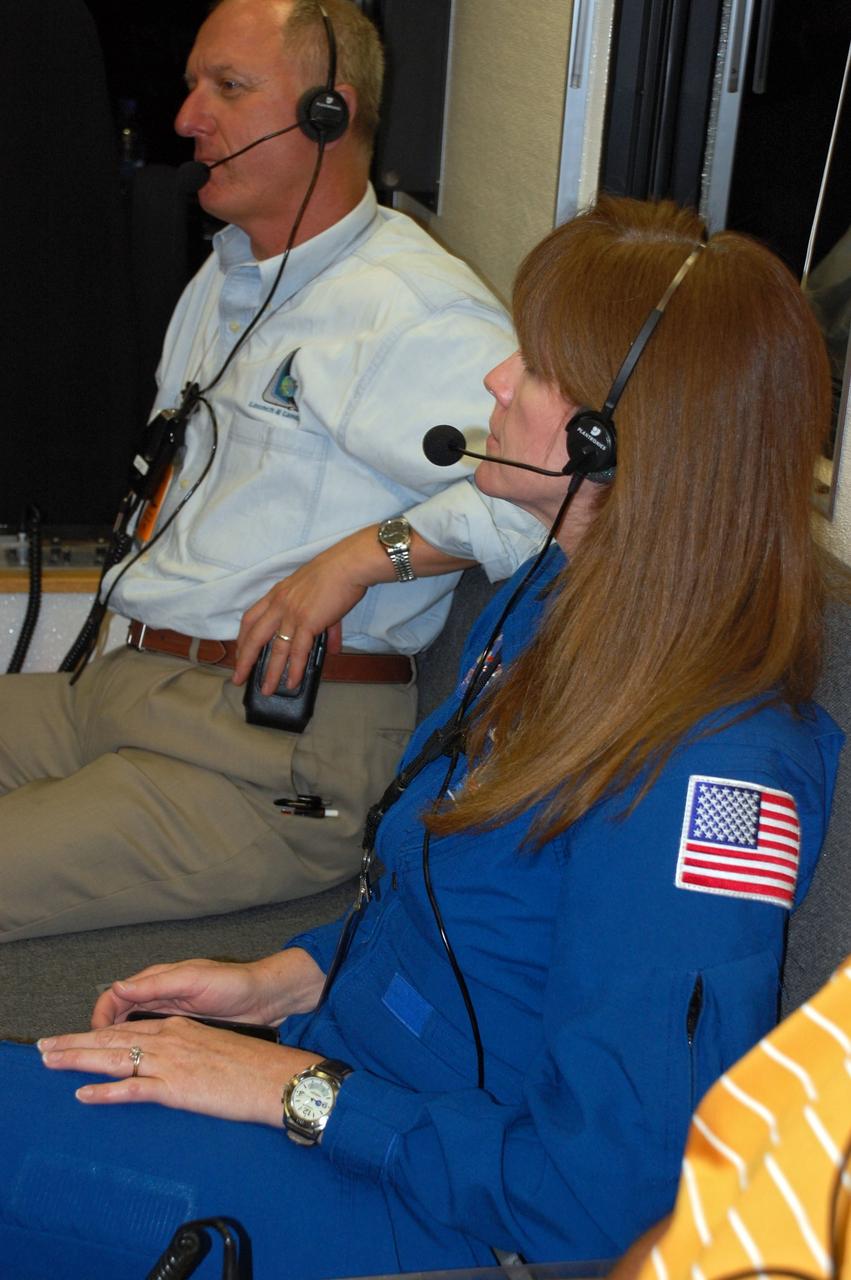 CAPE CANAVERAL, Fla. -- At NASA's Kennedy Space Center in Florida, a team of highly trained personnel inside the Convoy Command Vehicle is ready to "safe" shuttle Endeavour. The command vehicle is equipped to control critical communications between the crew still aboard Endeavour and the Launch Control Center. The team will monitor the health of the orbiter systems and direct convoy operations made up of about 40 vehicles, including 25 specially designed vehicles to assist the crew in leaving the shuttle, and prepare the vehicle for towing from the Shuttle Landing Facility to Orbiter Processing Facility-1. Accompanying the command convoy team are STS-134 assistant launch director Pete Nickolenko and NASA astronaut Janet Kavandi.    Endeavour's final return from space completed the 16-day, 6.5-million-mile STS-134 mission. Main gear touchdown was at 2:34:51 a.m. EDT, followed by nose gear touchdown at 2:35:04 a.m., and wheelstop at 2:35:36 a.m. STS-134 delivered the Alpha Magnetic Spectrometer-2 (AMS) and the Express Logistics Carrier-3 (ELC-3) to the International Space Station. AMS will help researchers understand the origin of the universe and search for evidence of dark matter, strange matter and antimatter from the station. ELC-3 carried spare parts that will sustain station operations once the shuttles are retired from service. STS-134 was the 25th and final flight for Endeavour, which spent 299 days in space, orbited Earth 4,671 times and traveled 122,883,151 miles. Photo credit: NASA/Ben Smegelsky
