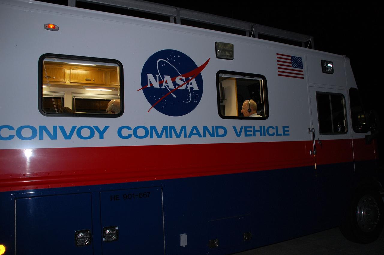 CAPE CANAVERAL, Fla. -- The Convoy Command Center vehicle is positioned near shuttle Endeavour on the Shuttle Landing Facility at NASA's Kennedy Space Center in Florida. The command vehicle is equipped to control critical communications between the crew still aboard Endeavour and the Launch Control Center. The team will monitor the health of the orbiter systems and direct convoy operations made up of about 40 vehicles, including 25 specially designed vehicles to assist the crew in leaving the shuttle, and prepare the vehicle for towing from the Shuttle Landing Facility to Orbiter Processing Facility-1.    Endeavour's final return from space completed the 16-day, 6.5-million-mile STS-134 mission. Main gear touchdown was at 2:34:51 a.m. EDT, followed by nose gear touchdown at 2:35:04 a.m., and wheelstop at 2:35:36 a.m. STS-134 delivered the Alpha Magnetic Spectrometer-2 (AMS) and the Express Logistics Carrier-3 (ELC-3) to the International Space Station. AMS will help researchers understand the origin of the universe and search for evidence of dark matter, strange matter and antimatter from the station. ELC-3 carried spare parts that will sustain station operations once the shuttles are retired from service. STS-134 was the 25th and final flight for Endeavour, which spent 299 days in space, orbited Earth 4,671 times and traveled 122,883,151 miles. Photo credit: NASA/Ben Smegelsky