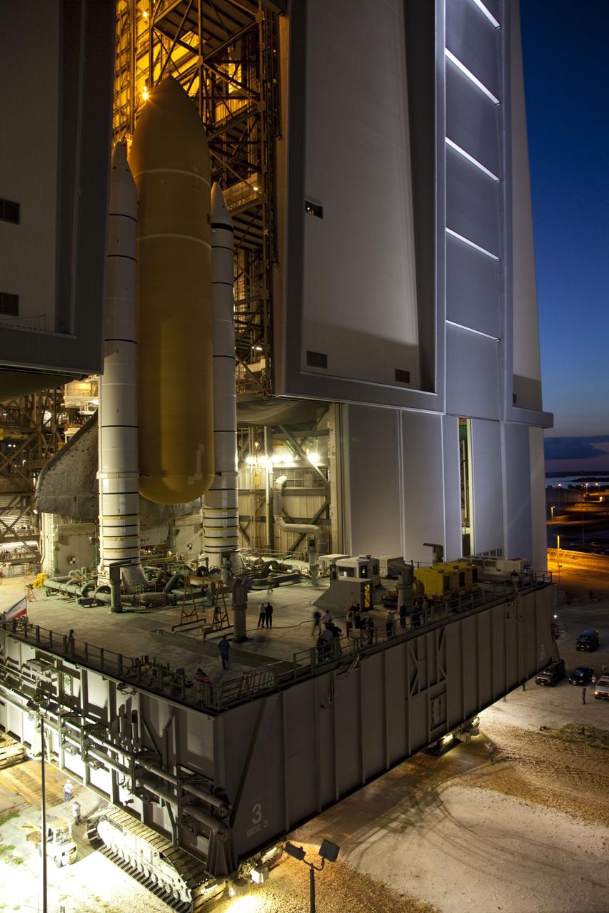 CAPE CANAVERAL, Fla. -- Space shuttle Atlantis, attached to its external fuel tank and solid rocket boosters atop a mobile launcher platform, slowly inches out of the Vehicle Assembly Building for the final time. "Rollout," to Launch Pad 39A at NASA's Kennedy Space Center in Florida began at 8:42 p.m. EDT. It will take the crawler-transporter about six hours to carry the shuttle stack to its seaside launch pad. The milestone move, known as "rollout," paves the way for the launch of the STS-135 mission to the International Space Station, targeted for July 8. STS-135 will be the 33rd flight of Atlantis, the 37th shuttle mission to the space station, and the 135th and final mission of NASA's Space Shuttle Program. For more information visit: www.nasa.gov/mission_pages/shuttle/shuttlemissions/sts135/index.html. Photo credit: NASA/Terry Zaperach