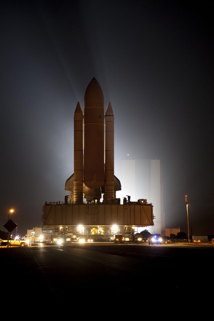 CAPE CANAVERAL, Fla. -- Bathed in xenon lights, space shuttle Atlantis embarks on its final journey from the Vehicle Assembly Building to Launch Pad 39A at NASA's Kennedy Space Center in Florida. First motion was at 8:42 p.m. EDT. It will take the crawler-transporter about six hours to carry the shuttle, attached to its external fuel tank and solid rocket boosters, to the seaside launch pad.              The milestone move, known as "rollout," paves the way for the launch of the STS-135 mission to the International Space Station, targeted for July 8. STS-135 will be the 33rd flight of Atlantis, the 37th shuttle mission to the space station, and the 135th and final mission of NASA's Space Shuttle Program. For more information visit: www.nasa.gov/mission_pages/shuttle/shuttlemissions/sts135/index.html. Photo credit: NASA/Terry Zaperach
