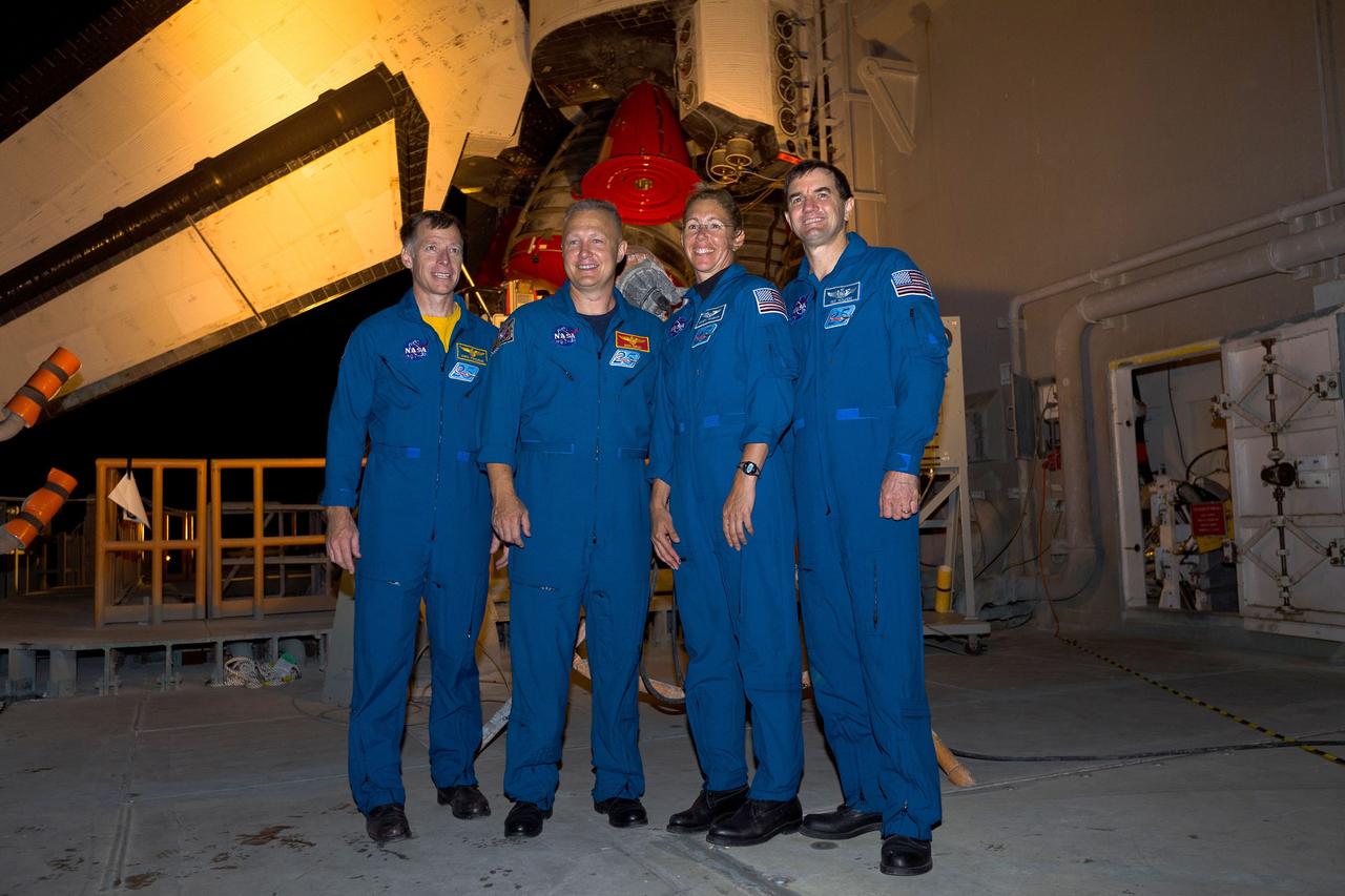 CAPE CANAVERAL, Fla. -- Accompanying space shuttle Atlantis on its "rollout" to Launch Pad 39A at NASA's Kennedy Space Center in Florida are from left, STS-135 Commander Chris Ferguson, Pilot Doug Hurley, Mission Specialists Sandy Magnus and Rex Walheim. It will take the crawler-transporter about six hours to carry the shuttle stack to its seaside launch pad. The milestone move, known as "rollout," paves the way for the launch of the STS-135 mission to the International Space Station, targeted for July 8. STS-135 will be the 33rd flight of Atlantis, the 37th shuttle mission to the space station, and the 135th and final mission of NASA's Space Shuttle Program. For more information visit: www.nasa.gov/mission_pages/shuttle/shuttlemissions/sts135/index.html. Photo credit: Courtesy of Scott Andrews/Canon