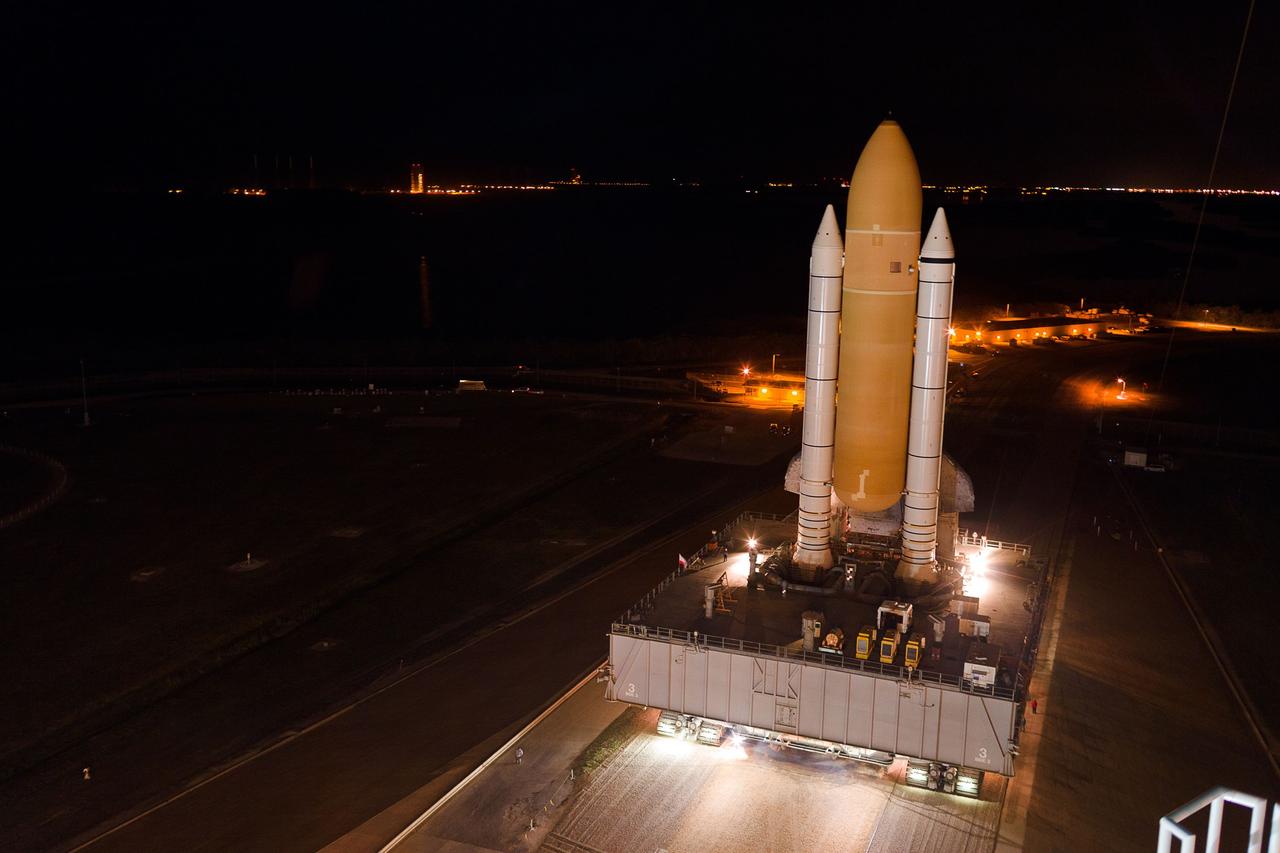 CAPE CANAVERAL, Fla. -- At a slow pace of about 1 mph, space shuttle Atlantis makes its final journey from the Vehicle Assembly Building to Launch Pad 39A at NASA's Kennedy Space Center in Florida. First motion was at 8:42 p.m. EDT. It will take the crawler-transporter about six hours to carry the shuttle, attached to its external fuel tank and solid rocket boosters, to the seaside launch pad.                    The milestone move, known as "rollout," paves the way for the launch of the STS-135 mission to the International Space Station, targeted for July 8. STS-135 will be the 33rd flight of Atlantis, the 37th shuttle mission to the space station, and the 135th and final mission of NASA's Space Shuttle Program. For more information visit: www.nasa.gov/mission_pages/shuttle/shuttlemissions/sts135/index.html. Photo credit: Courtesy of Scott Andrews/Canon