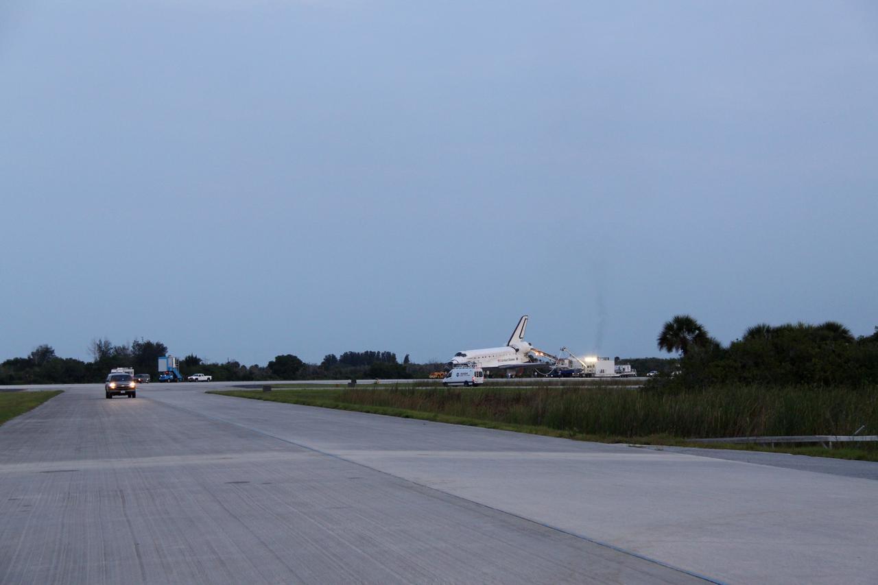 CAPE CANAVERAL, Fla. -- In the early morning hours after landing, space shuttle Endeavour's "towback" vehicle slowly pulls it from the Shuttle Landing Facility to Orbiter Processing Facility-1 at NASA's Kennedy Space Center in Florida. A purge unit that pumps conditioned air into a shuttle after landing is connected to Endeavour's aft end. Once inside the processing facility, Endeavour will be prepared for future public display.            Endeavour's final return from space completed the 16-day, 6.5-million-mile STS-134 mission. Main gear touchdown was at 2:34:51 a.m. EDT, followed by nose gear touchdown at 2:35:04 a.m., and wheelstop at 2:35:36 a.m.   Endeavour and its crew delivered the Alpha Magnetic Spectrometer-2 (AMS) and the Express Logistics Carrier-3 (ELC-3) to the International Space Station. AMS will help researchers understand the origin of the universe and search for evidence of dark matter, strange matter and antimatter from the station. ELC-3 carried spare parts that will sustain station operations once the shuttles are retired from service. STS-134 was the 25th and final flight for Endeavour, which spent 299 days in space, orbited Earth 4,671 times and traveled 122,883,151 miles. Photo credit: NASA/Jack Pfaller