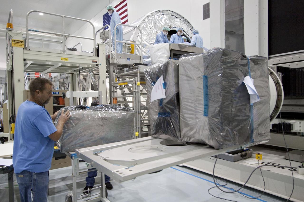 CAPE CANAVERAL, Fla. -- In the Space Station Processing Facility at NASA's Kennedy Space Center in Florida, cargo is being prepared for installation inside the Raffaello multi-purpose logistics module for shuttle Atlantis' flight to the International Space Station. Commander Chris Ferguson, Pilot Doug Hurley and Mission Specialists Sandra Magnus and Rex Walheim are targeted to lift off on July 8, taking with them the Raffaello multi-purpose logistics module packed with supplies, logistics and spare parts. The STS-135 mission also will fly a system to investigate the potential for robotically refueling existing spacecraft and return a failed ammonia pump module to help NASA better understand the failure mechanism and improve pump designs for future systems. STS-135 will be the 33rd flight of Atlantis, the 37th shuttle mission to the space station, and the 135th and final mission of NASA's Space Shuttle Program. For more information visit, www.nasa.gov/mission_pages/shuttle/shuttlemissions/sts135/index.html. Photo credit: NASA/Jack Pfaller