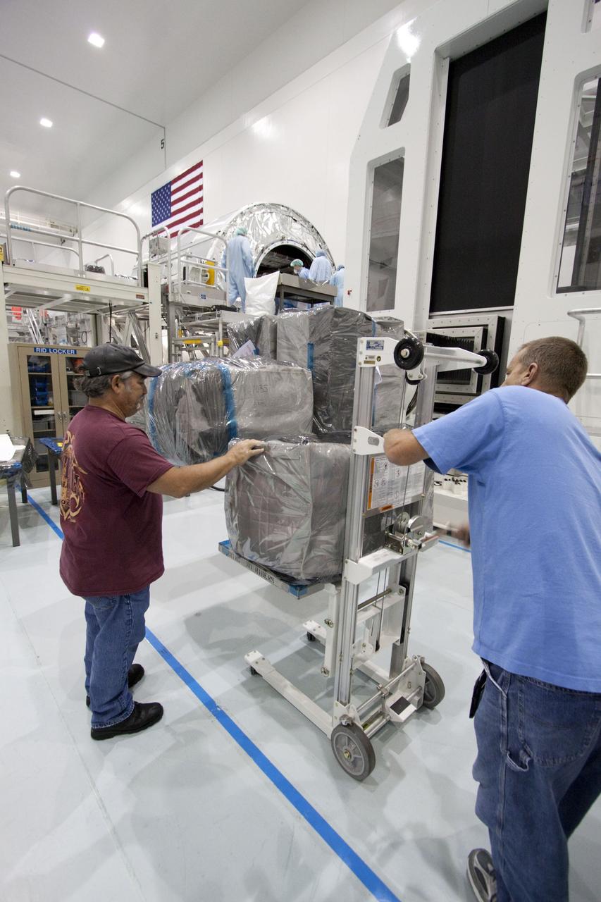 CAPE CANAVERAL, Fla. -- In the Space Station Processing Facility at NASA's Kennedy Space Center in Florida, cargo is being prepared for installation inside the Raffaello multi-purpose logistics module for shuttle Atlantis' flight to the International Space Station. Commander Chris Ferguson, Pilot Doug Hurley and Mission Specialists Sandra Magnus and Rex Walheim are targeted to lift off on July 8, taking with them the Raffaello multi-purpose logistics module packed with supplies, logistics and spare parts. The STS-135 mission also will fly a system to investigate the potential for robotically refueling existing spacecraft and return a failed ammonia pump module to help NASA better understand the failure mechanism and improve pump designs for future systems. STS-135 will be the 33rd flight of Atlantis, the 37th shuttle mission to the space station, and the 135th and final mission of NASA's Space Shuttle Program. For more information visit, www.nasa.gov/mission_pages/shuttle/shuttlemissions/sts135/index.html. Photo credit: NASA/Jack Pfaller
