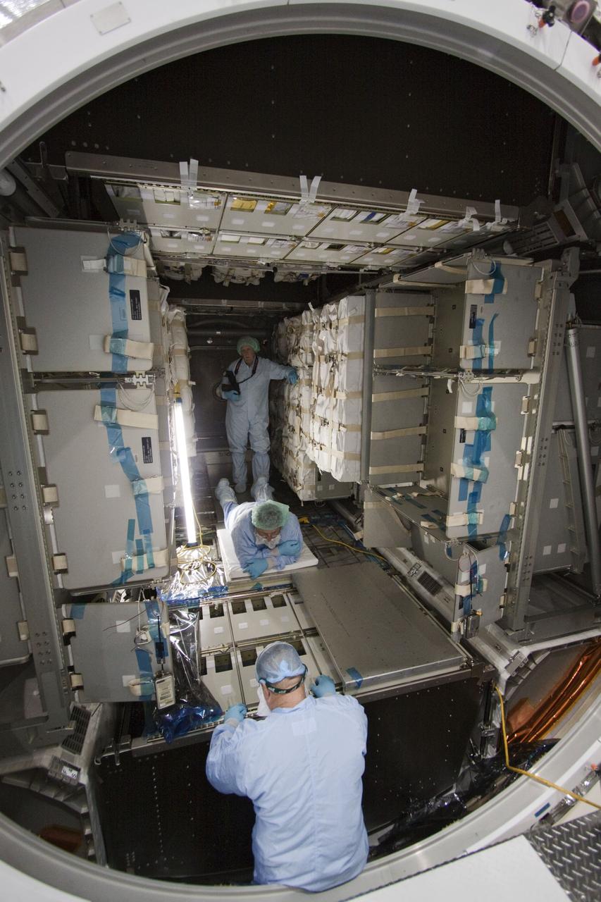 CAPE CANAVERAL, Fla. -- In the Space Station Processing Facility at NASA's Kennedy Space Center in Florida, technicians garbed in protective wear, commonly known as 'bunny suits,' install cargo inside the Raffaello multi-purpose logistics module for shuttle Atlantis' flight to the International Space Station. Commander Chris Ferguson, Pilot Doug Hurley and Mission Specialists Sandra Magnus and Rex Walheim are targeted to lift off on July 8, taking with them the Raffaello multi-purpose logistics module packed with supplies, logistics and spare parts. The STS-135 mission also will fly a system to investigate the potential for robotically refueling existing spacecraft and return a failed ammonia pump module to help NASA better understand the failure mechanism and improve pump designs for future systems. STS-135 will be the 33rd flight of Atlantis, the 37th shuttle mission to the space station, and the 135th and final mission of NASA's Space Shuttle Program. For more information visit, www.nasa.gov/mission_pages/shuttle/shuttlemissions/sts135/index.html. Photo credit: NASA/Jack Pfaller