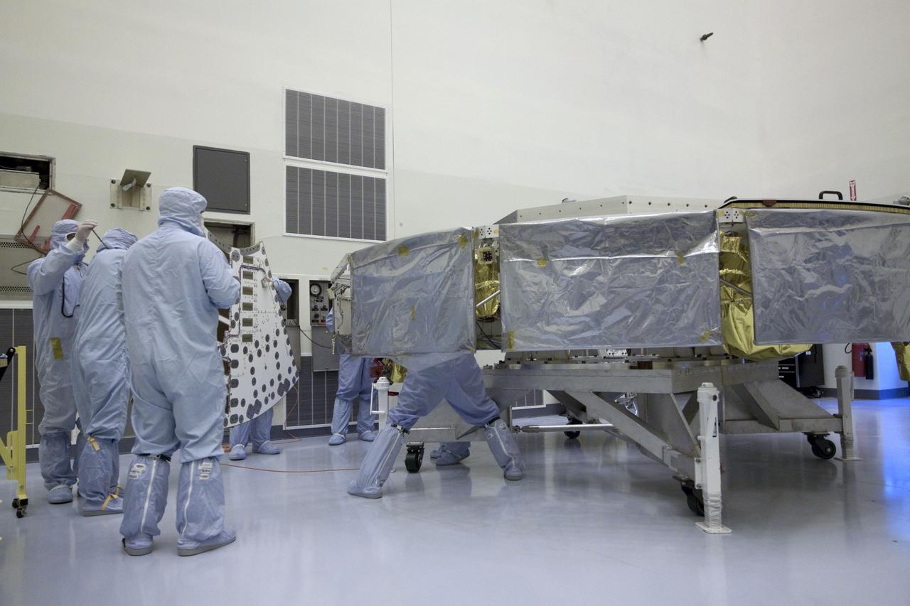 Cape Canaveral, Fla. -- At the Payload Hazardous Servicing Facility at NASA's Kennedy Space Center in Florida, technicians are installing a solar array panel to the cruise stage of NASA's Mars Science Laboratory (MSL). MSL's components include a compact car-sized rover, Curiosity, which has 10 science instruments designed to search for evidence on whether Mars has had environments favorable to microbial life, including chemical ingredients for life. The unique rover will use a laser to look inside rocks and release its gasses so that the rover’s spectrometer can analyze and send the data back to Earth. Launch of MSL aboard a United Launch Alliance Atlas V rocket is scheduled for Nov. 25 from Space Launch Complex 41 on Cape Canaveral Air Force Station in Florida. For more information, visit http://www.nasa.gov/msl. Photo credit: NASA/Jack Pfaller