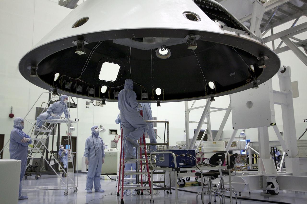 Cape Canaveral, Fla. -- At the Payload Hazardous Servicing Facility at NASA's Kennedy Space Center in Florida, technicians process the backshell for NASA's Mars Science Laboratory (MSL). The backshell carries the parachute and several components used during later stages of entry, descent and landing, and is one part of the spacecraft's heat shield which, when both are integrated is called an aeroshell. MSL's components include a compact car-sized rover, Curiosity, which has 10 science instruments designed to search for evidence on whether Mars has had environments favorable to microbial life, including chemical ingredients for life. The unique rover will use a laser to look inside rocks and release its gasses so that the rover’s spectrometer can analyze and send the data back to Earth. Launch of MSL aboard a United Launch Alliance Atlas V rocket is scheduled for Nov. 25 from Space Launch Complex 41 on Cape Canaveral Air Force Station in Florida. For more information, visit http://www.nasa.gov/msl. Photo credit: NASA/Jack Pfaller
