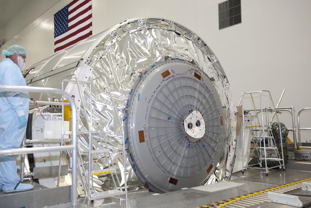 CAPE CANAVERAL, Fla. -- In the Space Station Processing Facility at NASA's Kennedy Space Center in Florida, technicians installed the aft hatch on the Raffaello multi-purpose logistics module for shuttle Atlantis' flight to the International Space Station.          Commander Chris Ferguson, Pilot Doug Hurley and Mission Specialists Sandra Magnus and Rex Walheim are targeted to lift off on July 8, taking with them the Raffaello multi-purpose logistics module packed with supplies, logistics and spare parts. The STS-135 mission also will fly a system to investigate the potential for robotically refueling existing spacecraft and return a failed ammonia pump module to help NASA better understand the failure mechanism and improve pump designs for future systems. STS-135 will be the 33rd flight of Atlantis, the 37th shuttle mission to the space station, and the 135th and final mission of NASA's Space Shuttle Program. For more information visit, www.nasa.gov/mission_pages/shuttle/shuttlemissions/sts135/index.html. Photo credit: NASA/Jim Grossmann