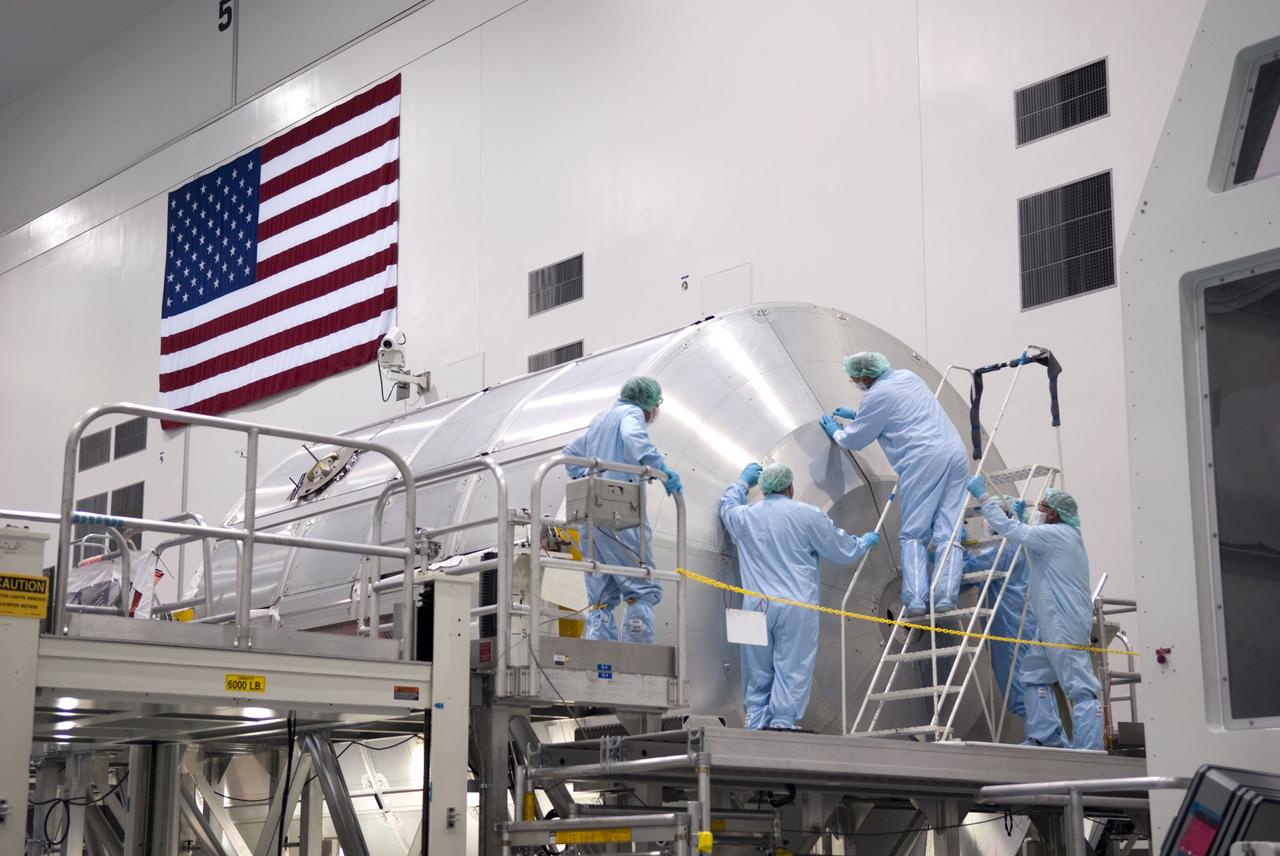 CAPE CANAVERAL, Fla. -- In the Space Station Processing Facility at NASA's Kennedy Space Center in Florida, technicians are installing a debris shield over the aft hatch on the Raffaello multi-purpose logistics module for shuttle Atlantis' flight to the International Space Station.      Commander Chris Ferguson, Pilot Doug Hurley and Mission Specialists Sandra Magnus and Rex Walheim are targeted to lift off on July 8, taking with them the Raffaello multi-purpose logistics module packed with supplies, logistics and spare parts. The STS-135 mission also will fly a system to investigate the potential for robotically refueling existing spacecraft and return a failed ammonia pump module to help NASA better understand the failure mechanism and improve pump designs for future systems. STS-135 will be the 33rd flight of Atlantis, the 37th shuttle mission to the space station, and the 135th and final mission of NASA's Space Shuttle Program. For more information visit, www.nasa.gov/mission_pages/shuttle/shuttlemissions/sts135/index.html. Photo credit: NASA/Jim Grossmann