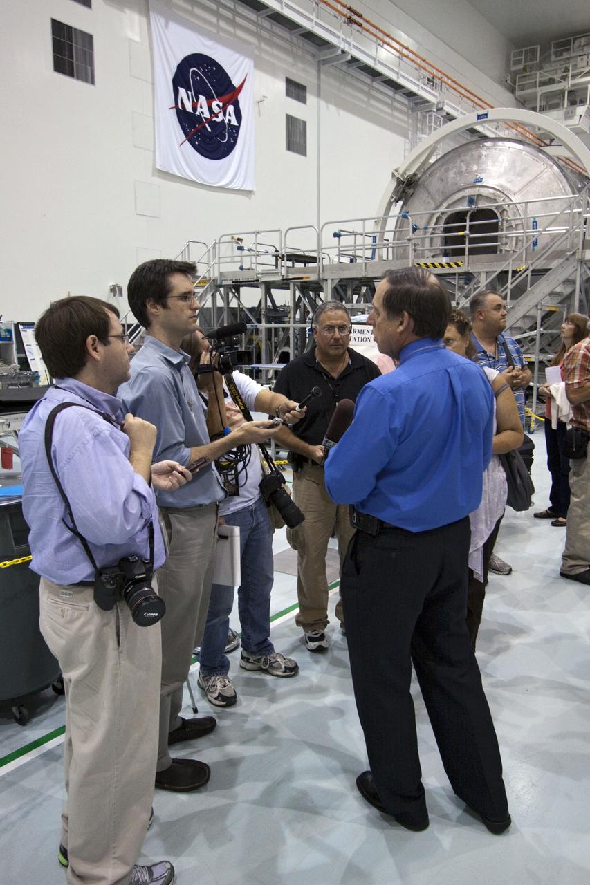 CAPE CANAVERAL, Fla. -- In the Space Station Processing Facility at NASA's Kennedy Space Center in Florida, Mike Kinslow, STS-135 Payload Flow Manager from Boeing Space Operations speaks to media about the payload for shuttle Atlantis' flight to the International Space Station. Commander Chris Ferguson, Pilot Doug Hurley and Mission Specialists Sandra Magnus and Rex Walheim are targeted to lift off on July 8, taking with them the Raffaello multi-purpose logistics module packed with supplies, logistics and spare parts. The STS-135 mission also will fly a system to investigate the potential for robotically refueling existing spacecraft and return a failed ammonia pump module to help NASA better understand the failure mechanism and improve pump designs for future systems. STS-135 will be the 33rd flight of Atlantis, the 37th shuttle mission to the space station, and the 135th and final mission of NASA's Space Shuttle Program. For more information visit, www.nasa.gov/mission_pages/shuttle/shuttlemissions/sts135/index.html. Photo credit: NASA/Jack Pfaller